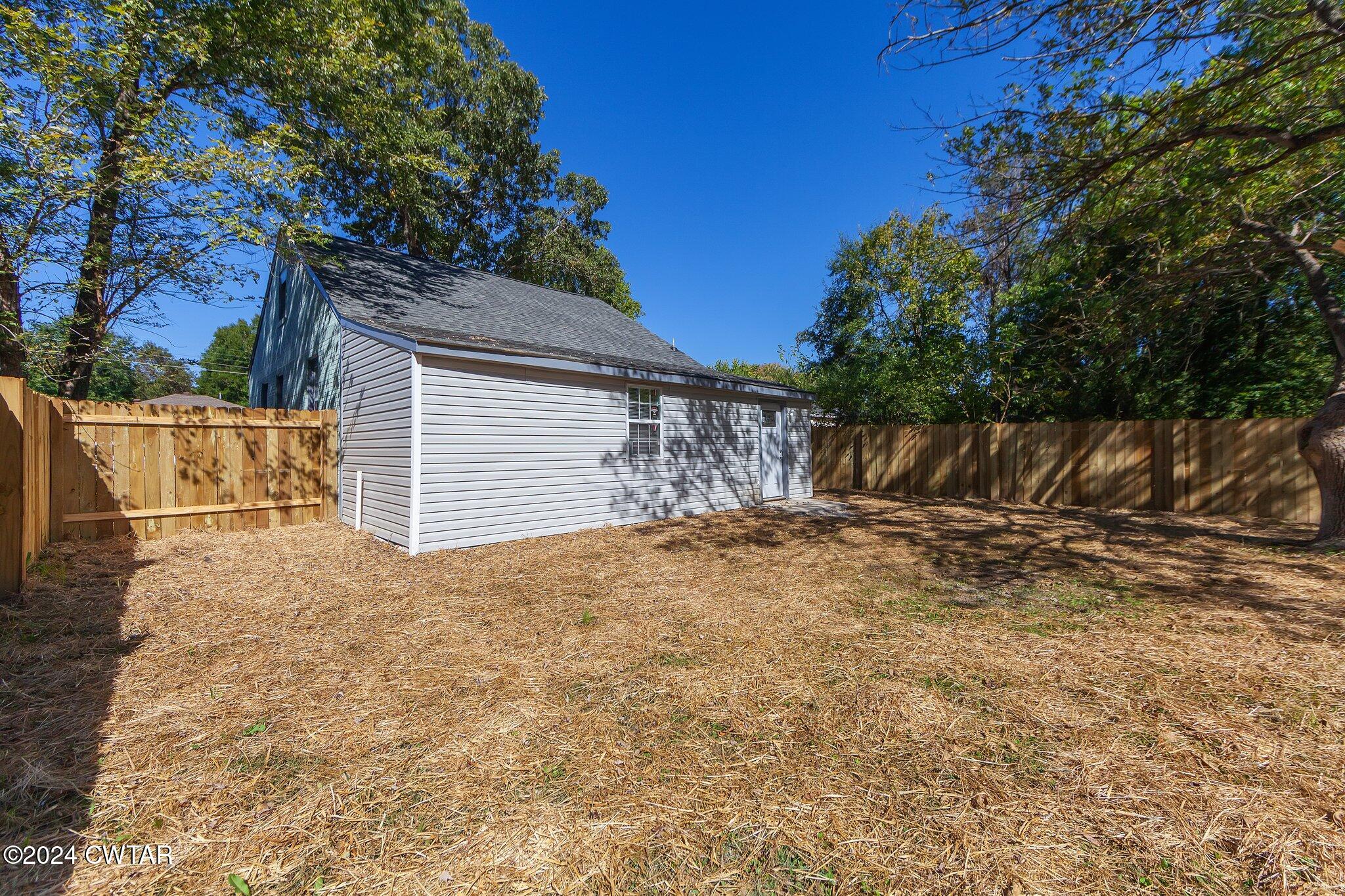 62 Everett Street Jackson, TN 38301 - Photo 25 of 28 a view of a yard with a tree