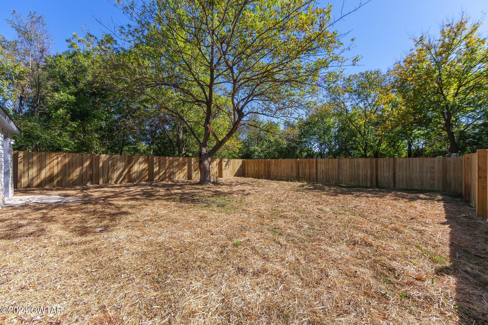 62 Everett Street Jackson, TN 38301 - Photo 27 of 28 a view of outdoor space with wooden fence