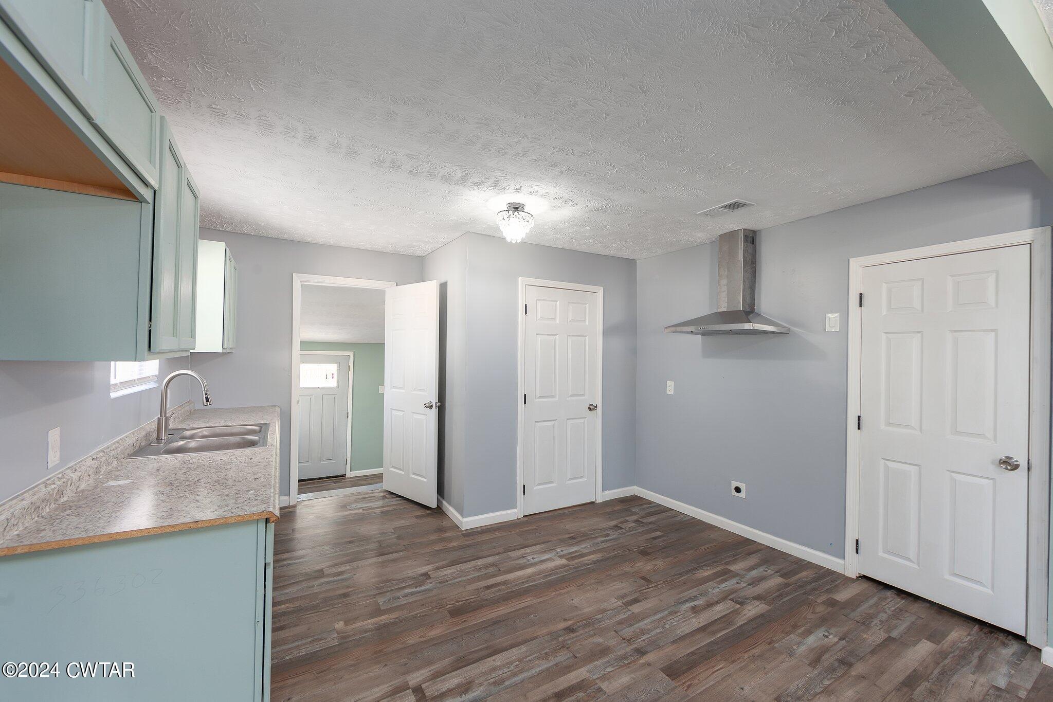 62 Everett Street Jackson, TN 38301 - Photo 9 of 28 a view of a kitchen cabinets and wooden floor