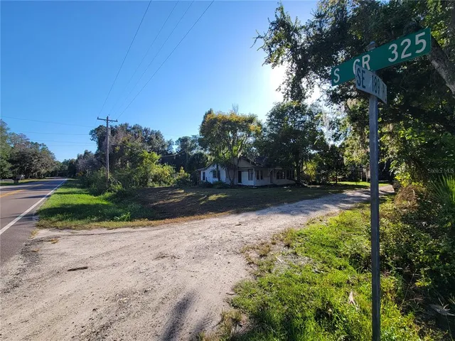 a view of a swimming pool and a yard