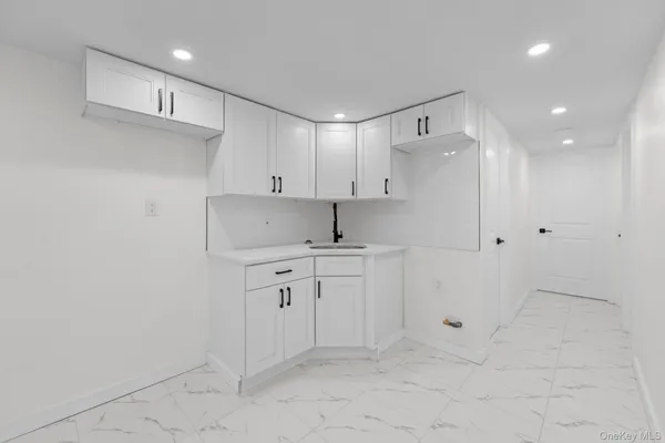 a kitchen with cabinets and sink