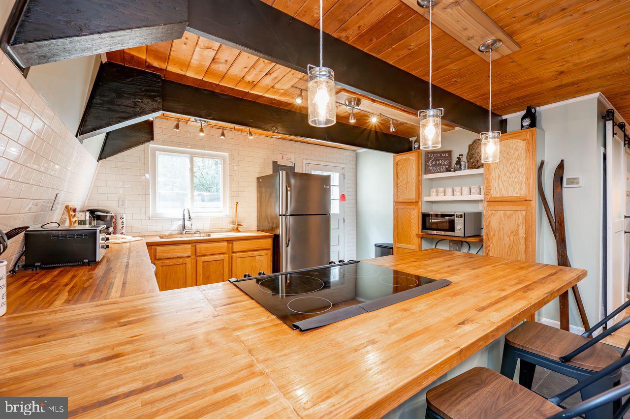 2678 Mayhew Inn Road Oakland, MD 21550 - Photo 14 of 33 Charming kitchen with rustic wood accents.