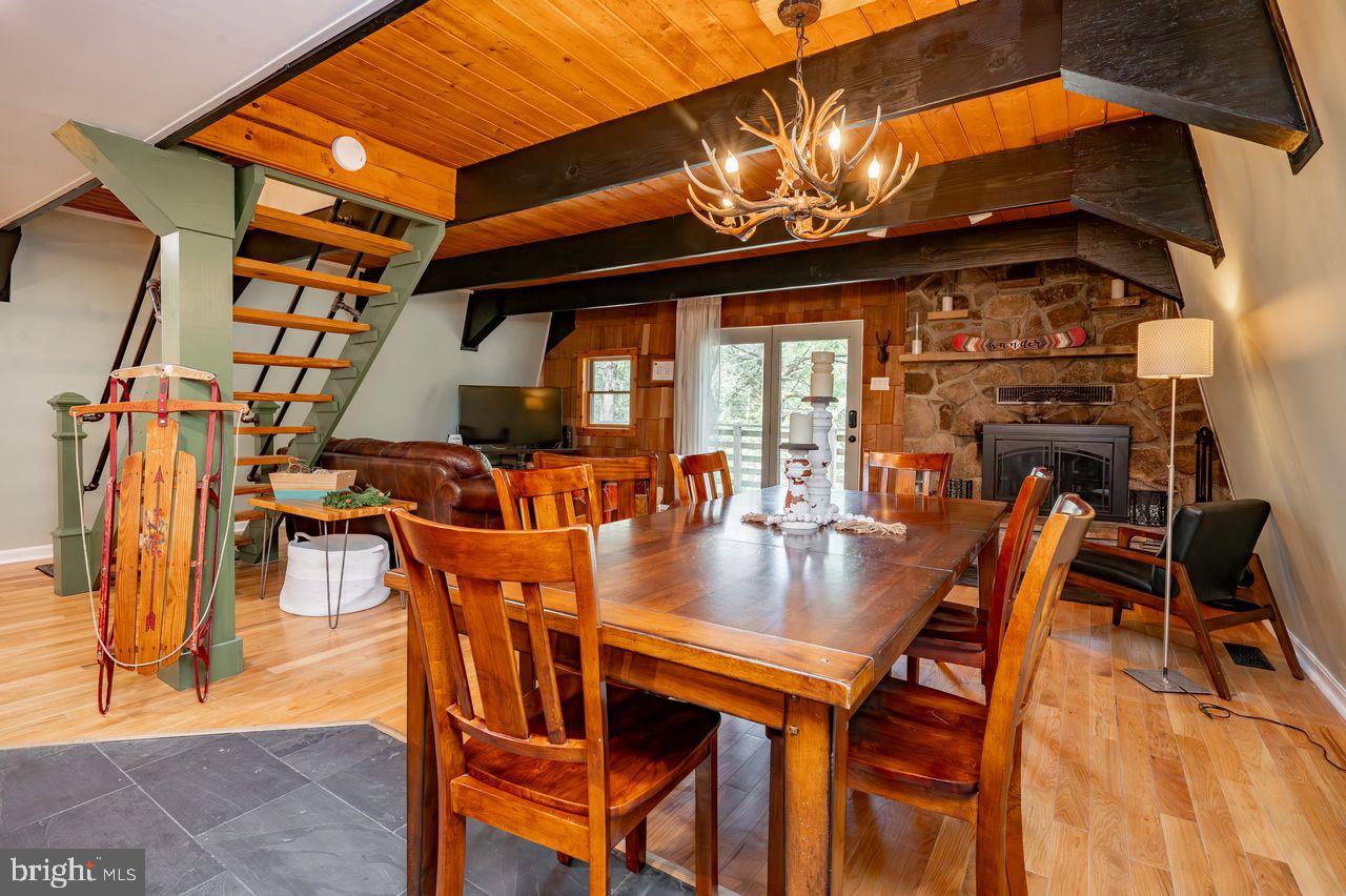 2678 Mayhew Inn Road Oakland, MD 21550 - Photo 16 of 33 Charming dining area with rustic elegance.