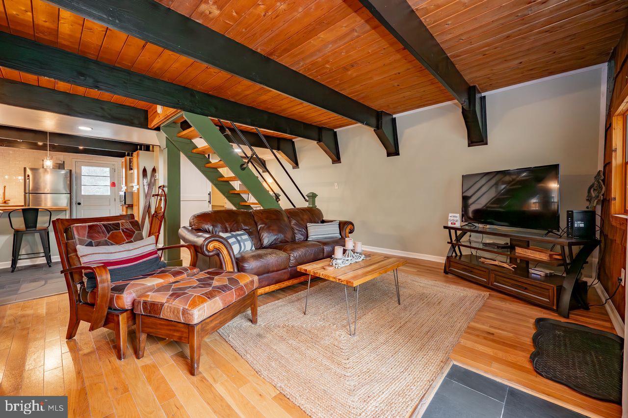 2678 Mayhew Inn Road Oakland, MD 21550 - Photo 19 of 33 Charming living space with rustic elegance.