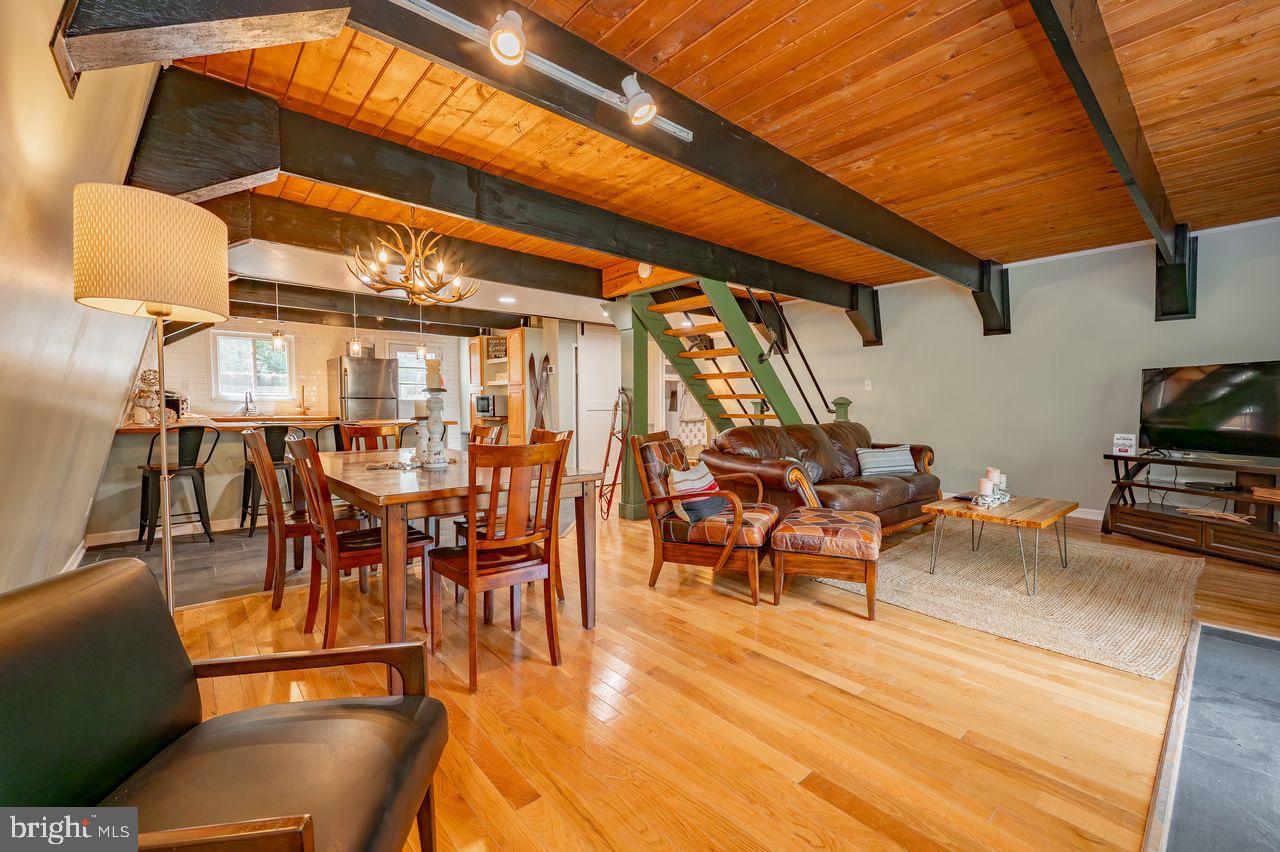 2678 Mayhew Inn Road Oakland, MD 21550 - Photo 20 of 33 Charming open-concept living space with warmth.