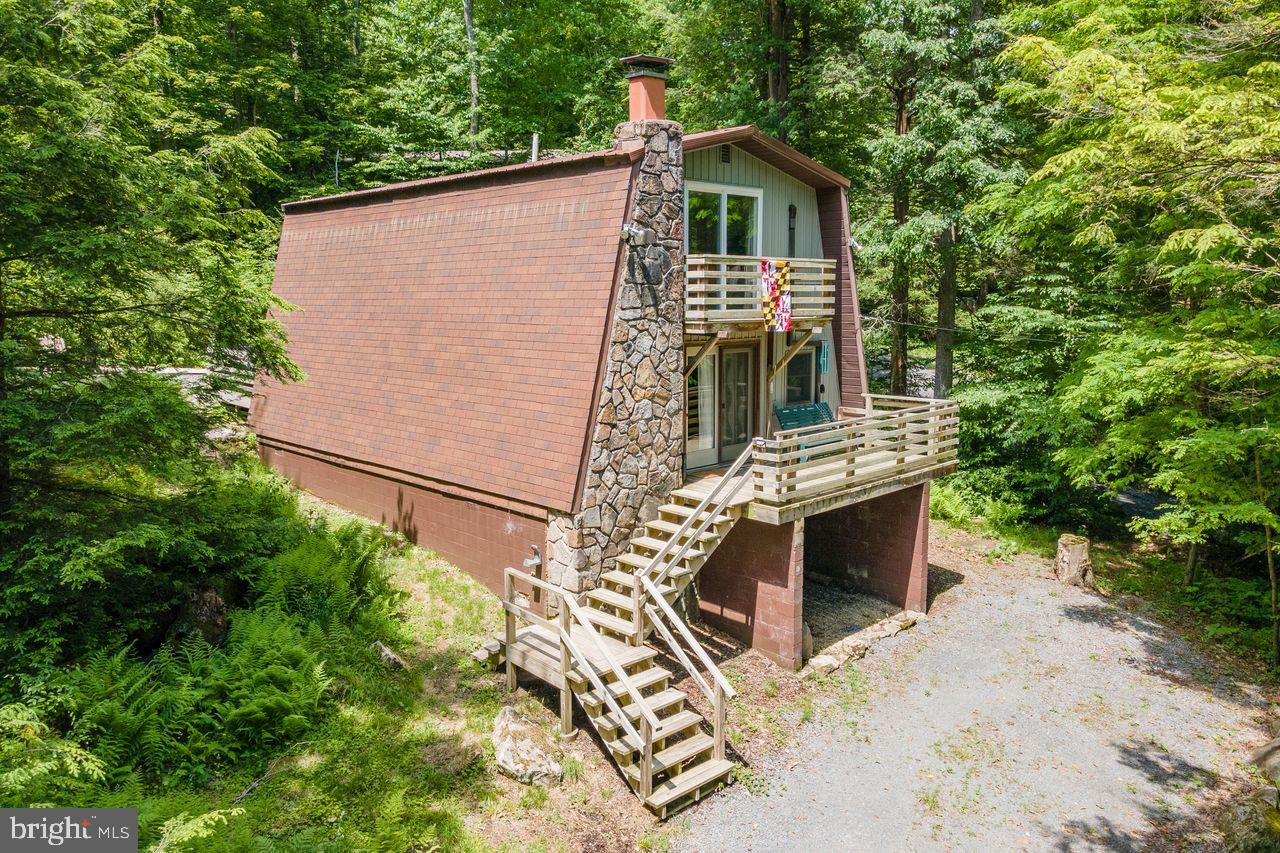 2678 Mayhew Inn Road Oakland, MD 21550 - Photo 2 of 33 Charming A-frame retreat in lush greenery.