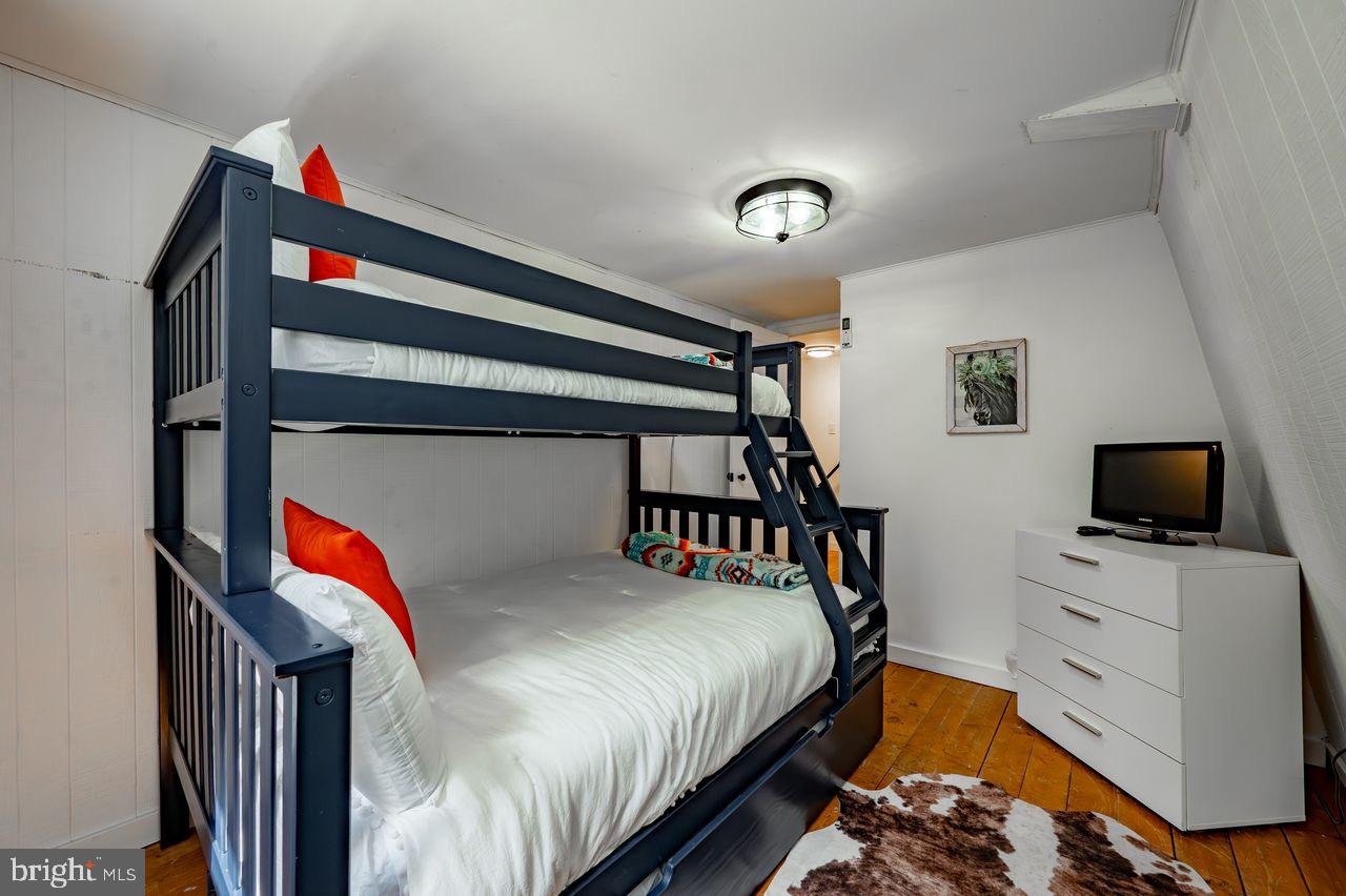 2678 Mayhew Inn Road Oakland, MD 21550 - Photo 24 of 33 Cozy bunk room with modern charm.