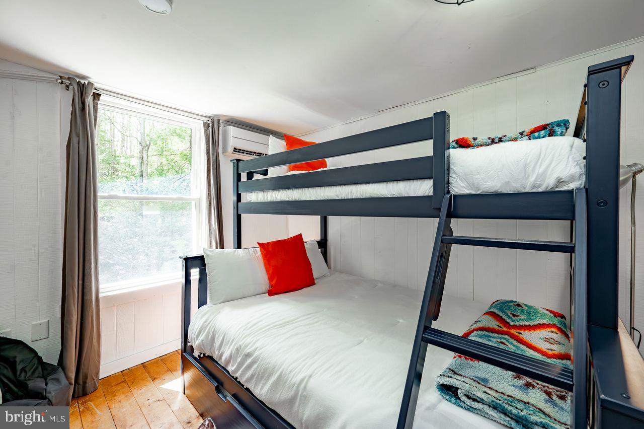 2678 Mayhew Inn Road Oakland, MD 21550 - Photo 25 of 33 Cozy bunk room with natural light.