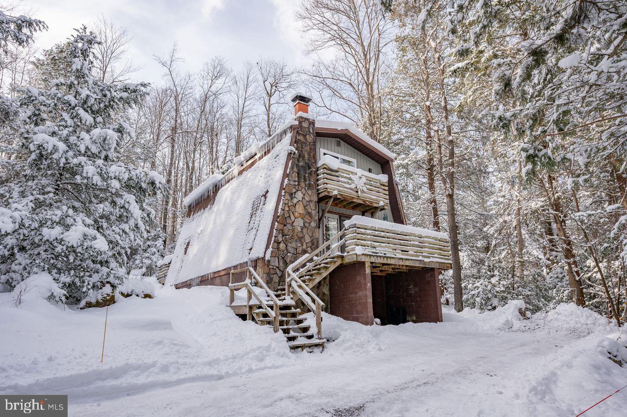 2678 Mayhew Inn Road Oakland, MD 21550 - Photo 3 of 33 Charming chalet nestled in winter's embrace.