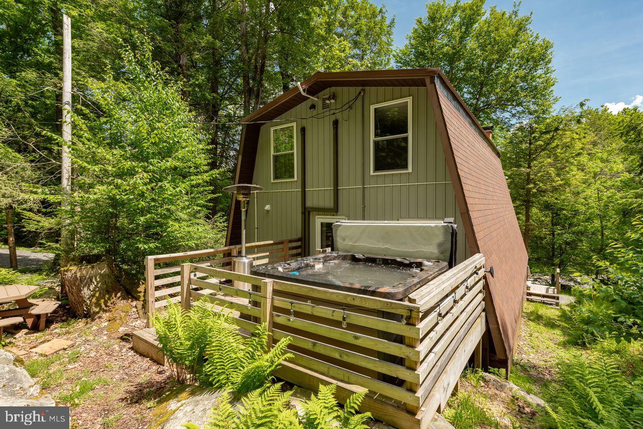 2678 Mayhew Inn Road Oakland, MD 21550 - Photo 7 of 33 Charming A-frame retreat in lush greenery.
