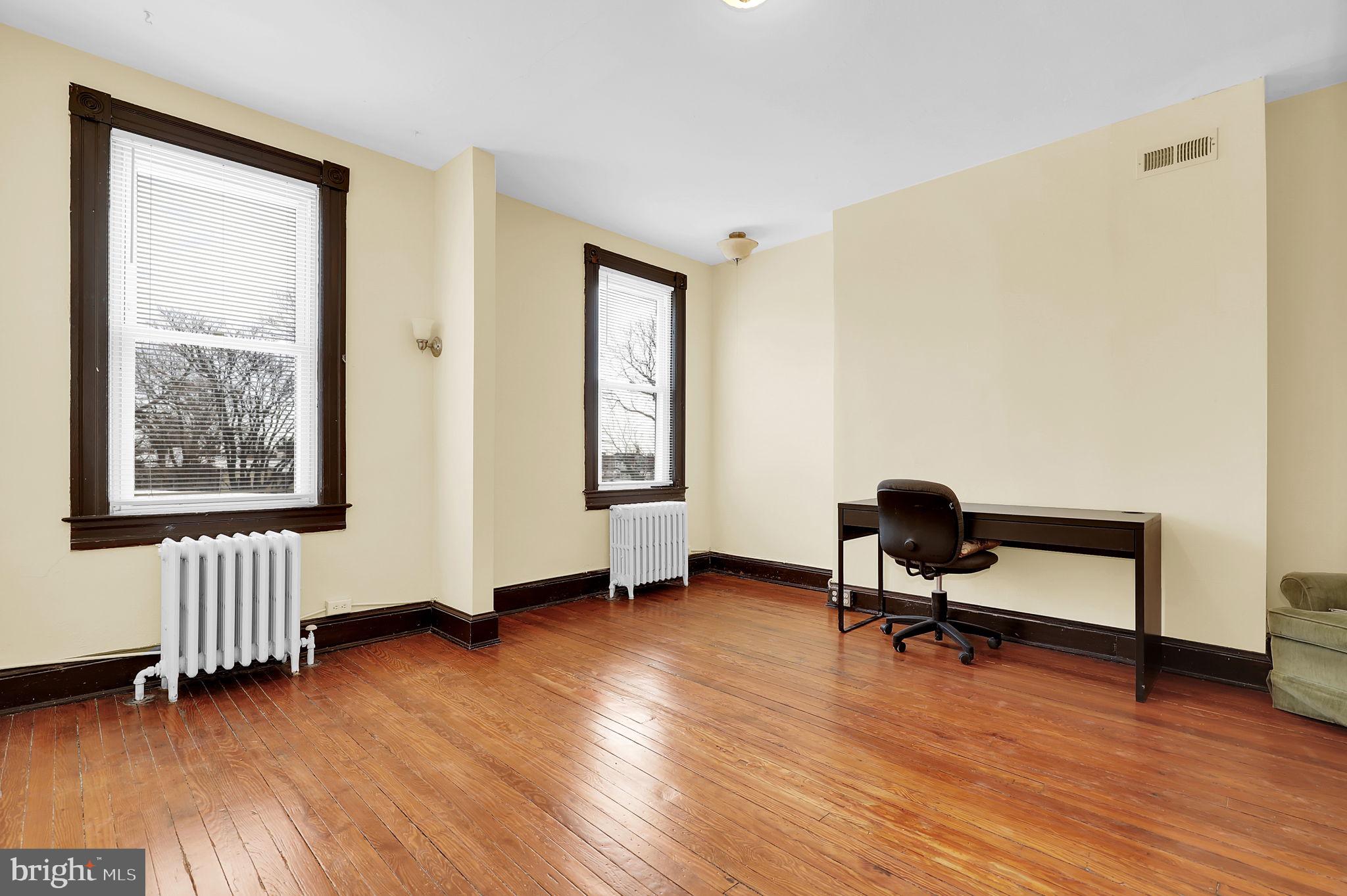 2511 North Calvert Street Baltimore, MD 21218 - Photo 23 of 37 a view of room with hardwood floor and workspace