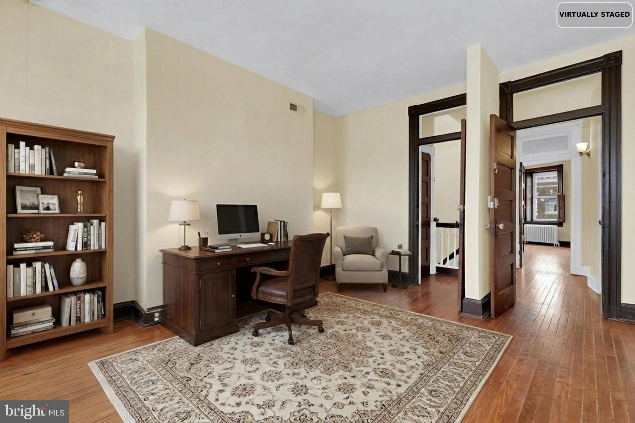2511 North Calvert Street Baltimore, MD 21218 - Photo 24 of 37 a living room with furniture and a rug