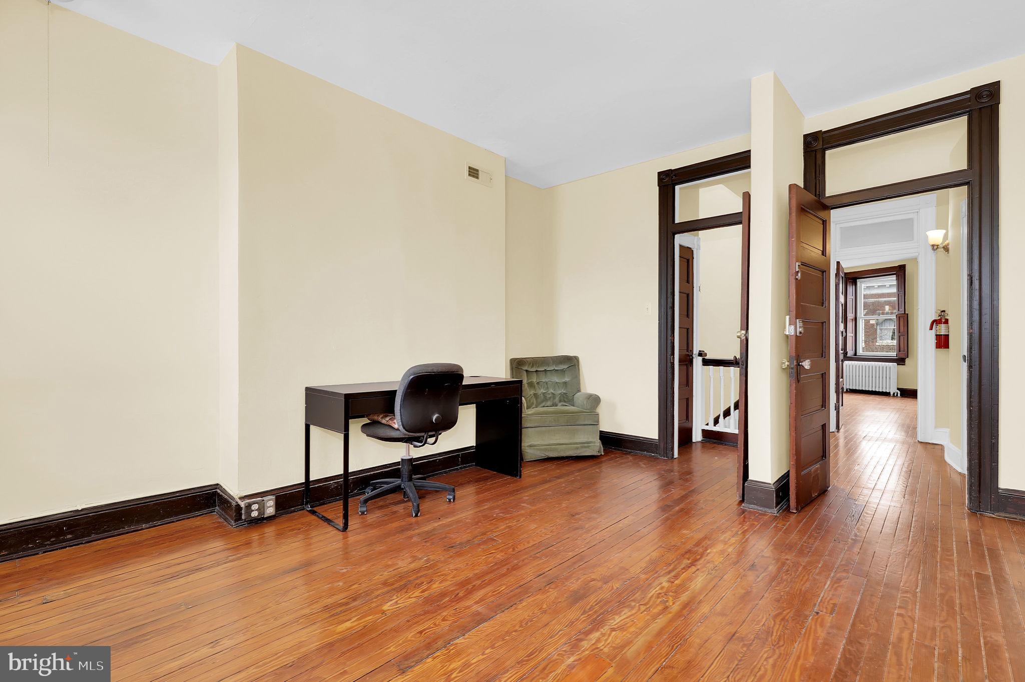2511 North Calvert Street Baltimore, MD 21218 - Photo 25 of 37 a view of a livingroom with furniture and a chair
