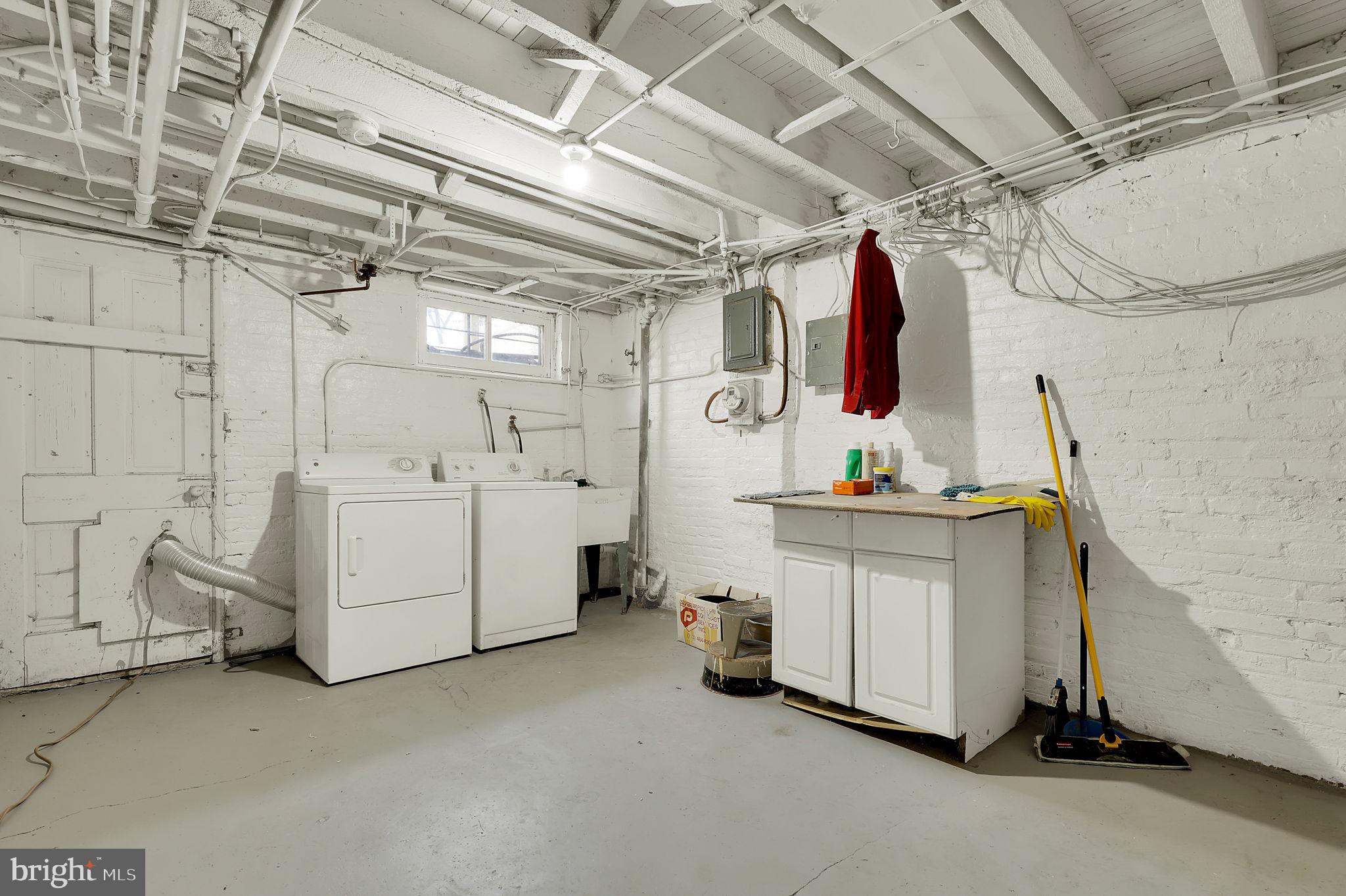 2511 North Calvert Street Baltimore, MD 21218 - Photo 31 of 37 a utility room with dryer and washer