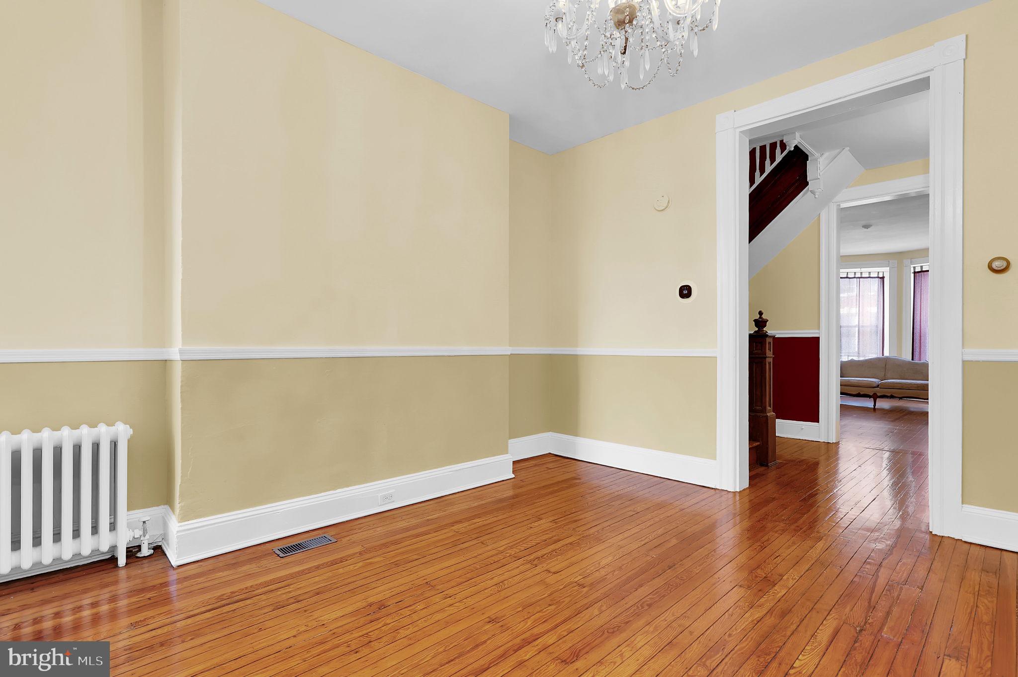 2511 North Calvert Street Baltimore, MD 21218 - Photo 8 of 37 a view of a room with wooden floor