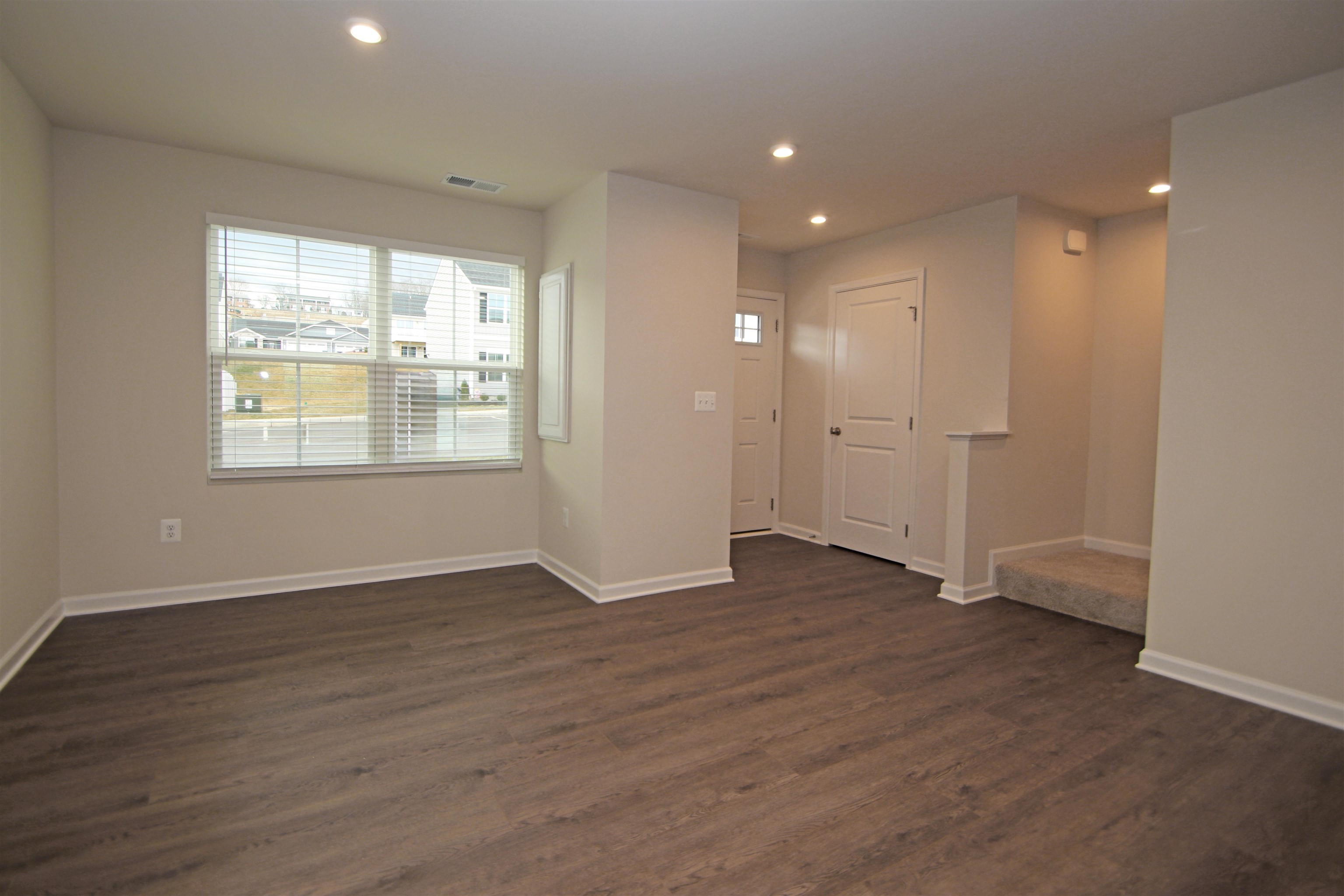 3325 Marble Loop Harrisonburg, VA 22801 - Photo 3 of 19 an empty room with wooden floor and windows