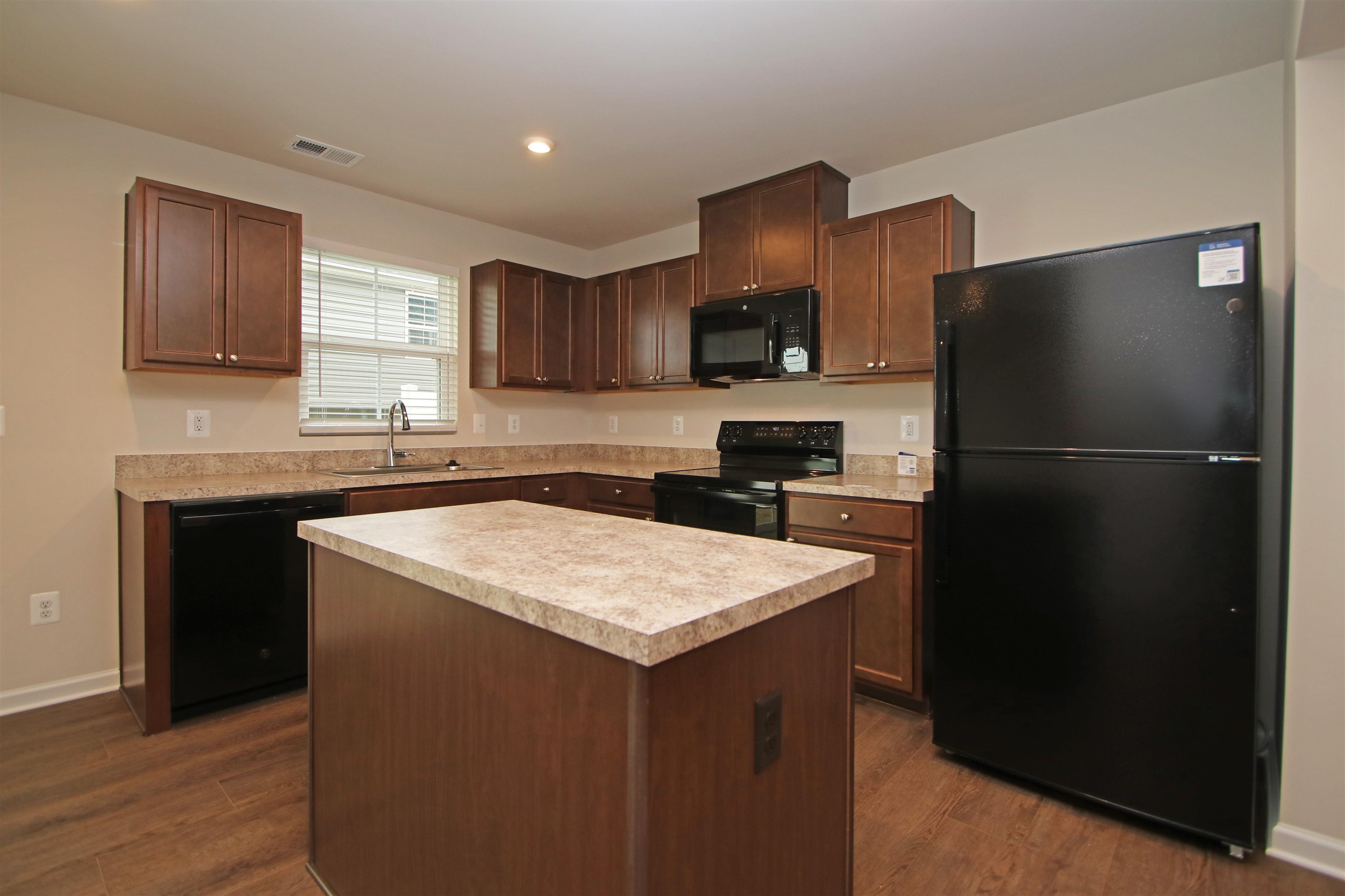 3325 Marble Loop Harrisonburg, VA 22801 - Photo 5 of 19 a kitchen with a sink a refrigerator and cabinets