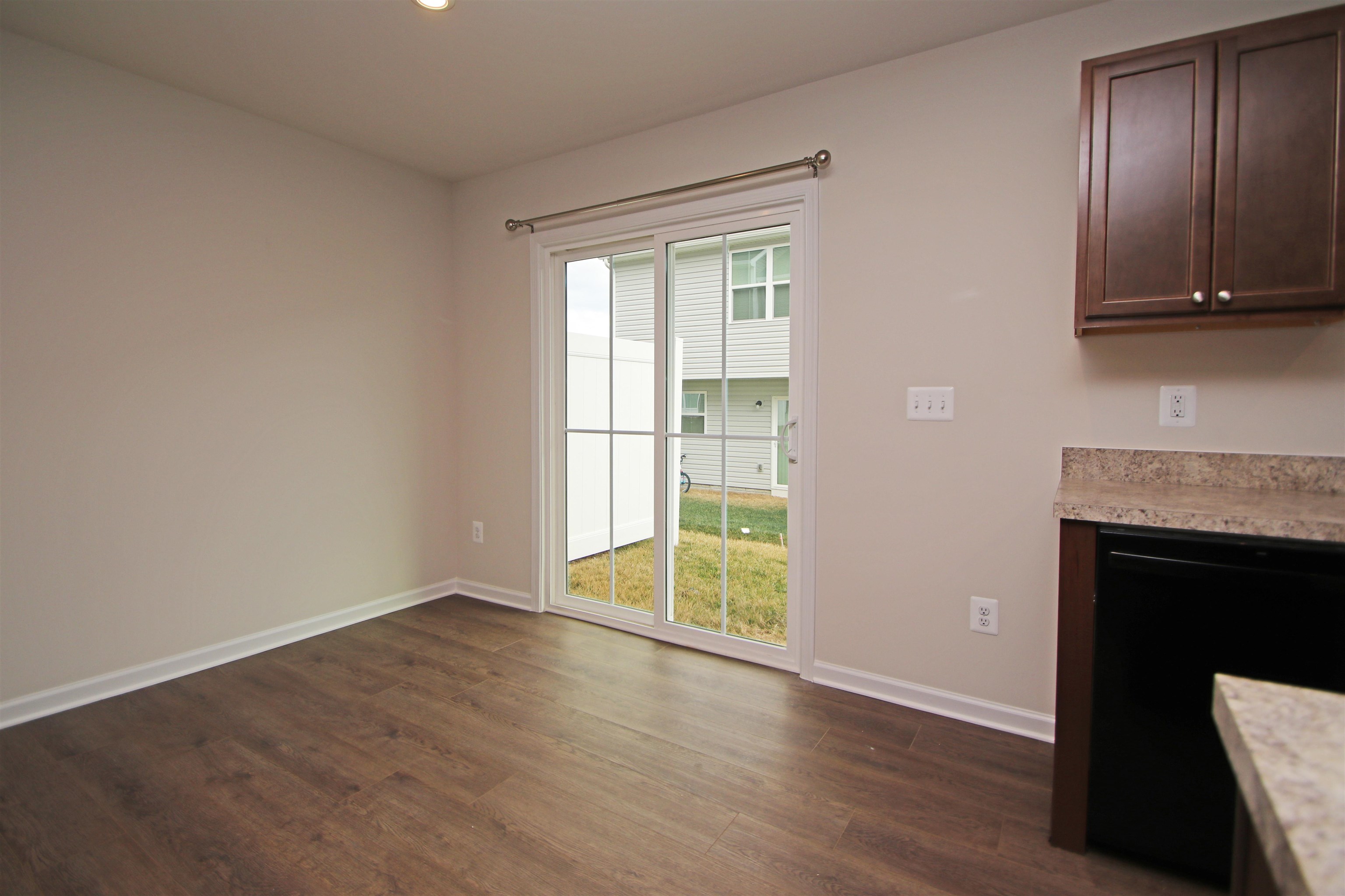3325 Marble Loop Harrisonburg, VA 22801 - Photo 7 of 19 a view of an empty room with wooden floor and a fireplace