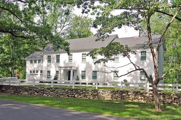 a view of house with yard