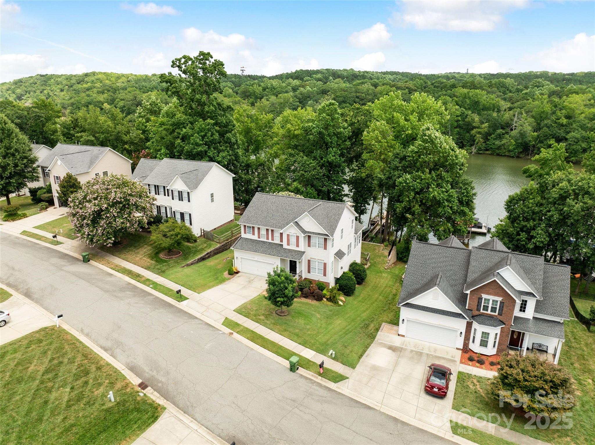 132 Lighthouse Road Mount Holly, NC 28120 - Photo 1 of 43 an aerial view of residential houses with outdoor space and trees