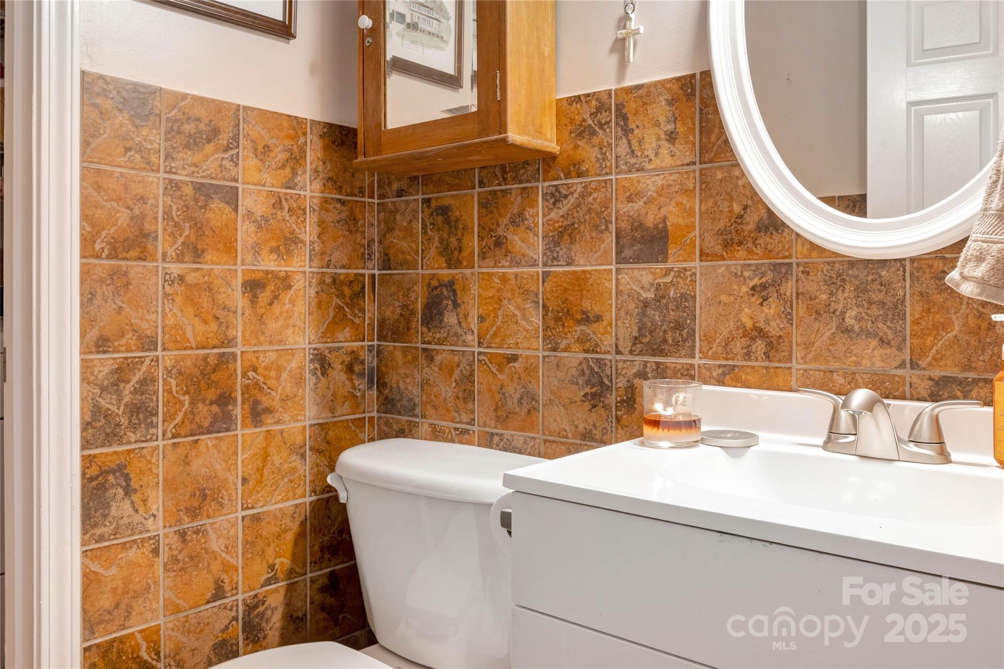 132 Lighthouse Road Mount Holly, NC 28120 - Photo 12 of 43 a bathroom with a sink and a mirror
