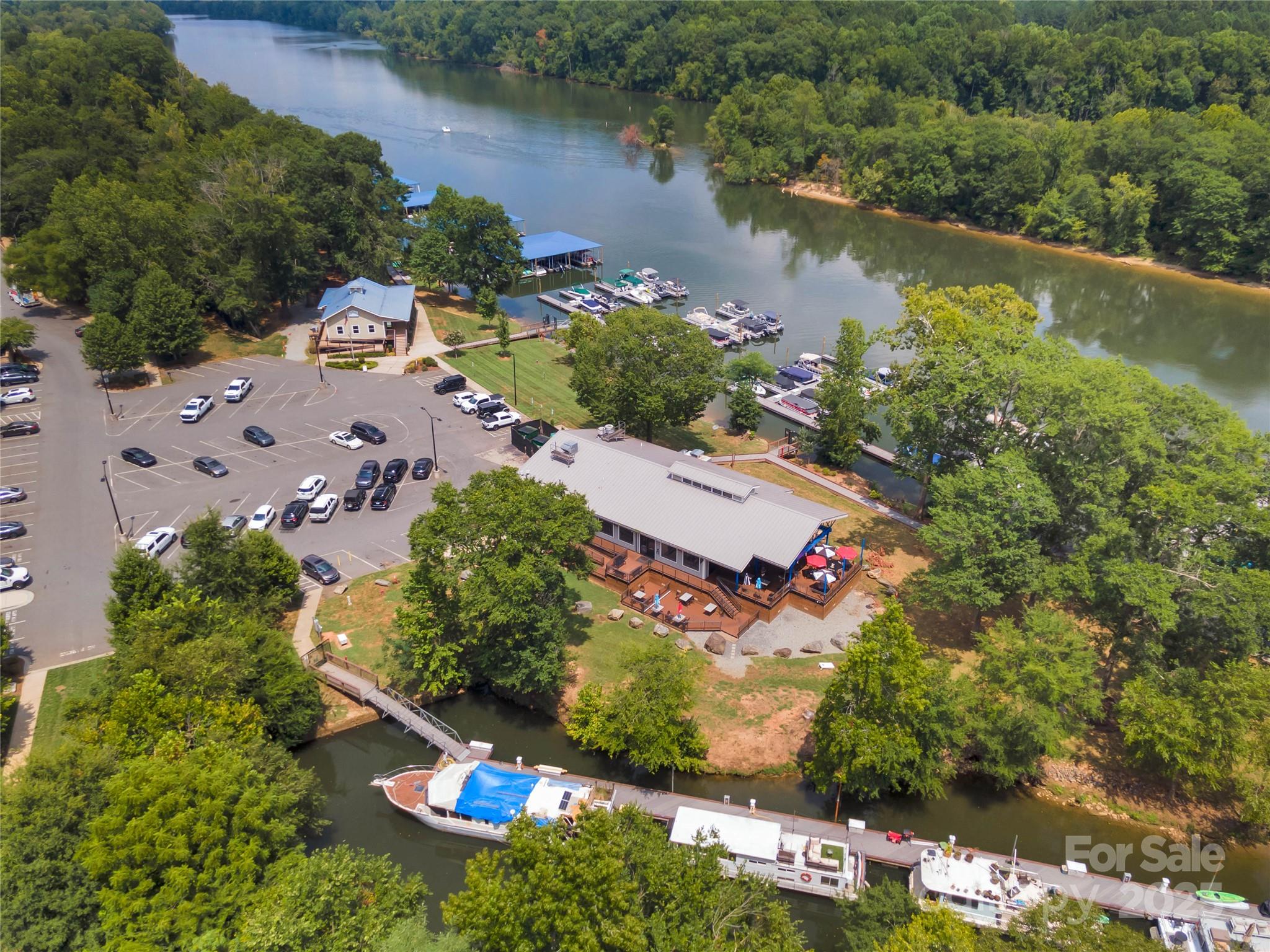 132 Lighthouse Road Mount Holly, NC 28120 - Photo 36 of 43 an aerial view of a house with a lake view