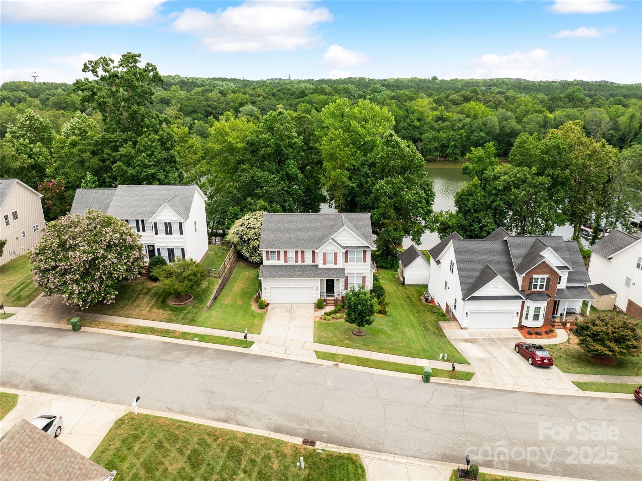 132 Lighthouse Road Mount Holly, NC 28120 - Photo 38 of 43 an aerial view of a house with a garden and mountain view