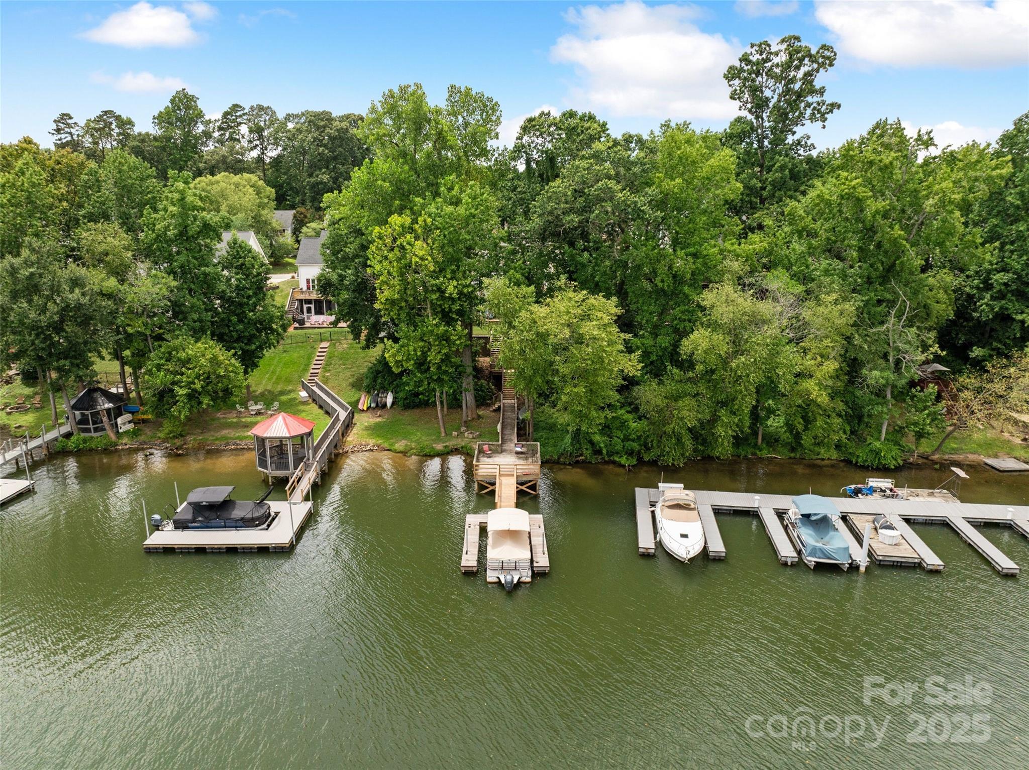 132 Lighthouse Road Mount Holly, NC 28120 - Photo 40 of 43 a view of a lake with houses