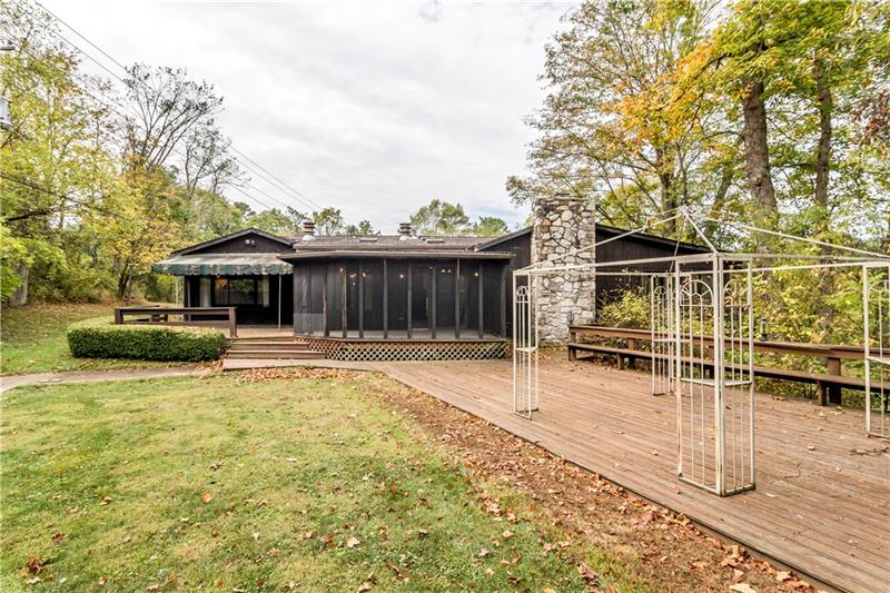 842 Bebout Road Venetia, PA 15367 - Photo 23 of 25 Back of home with the screened porch, deck and access to the Decks.
