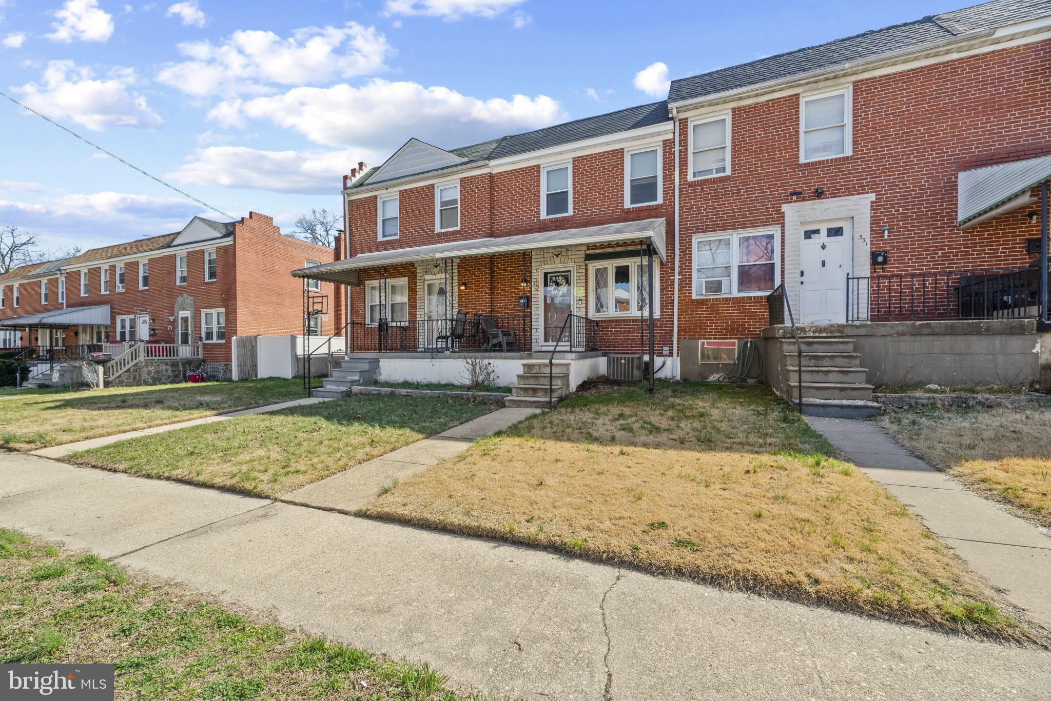 353 Leeanne Road Essex, MD 21221 - Photo 2 of 29 a view of a brick building next to a yard