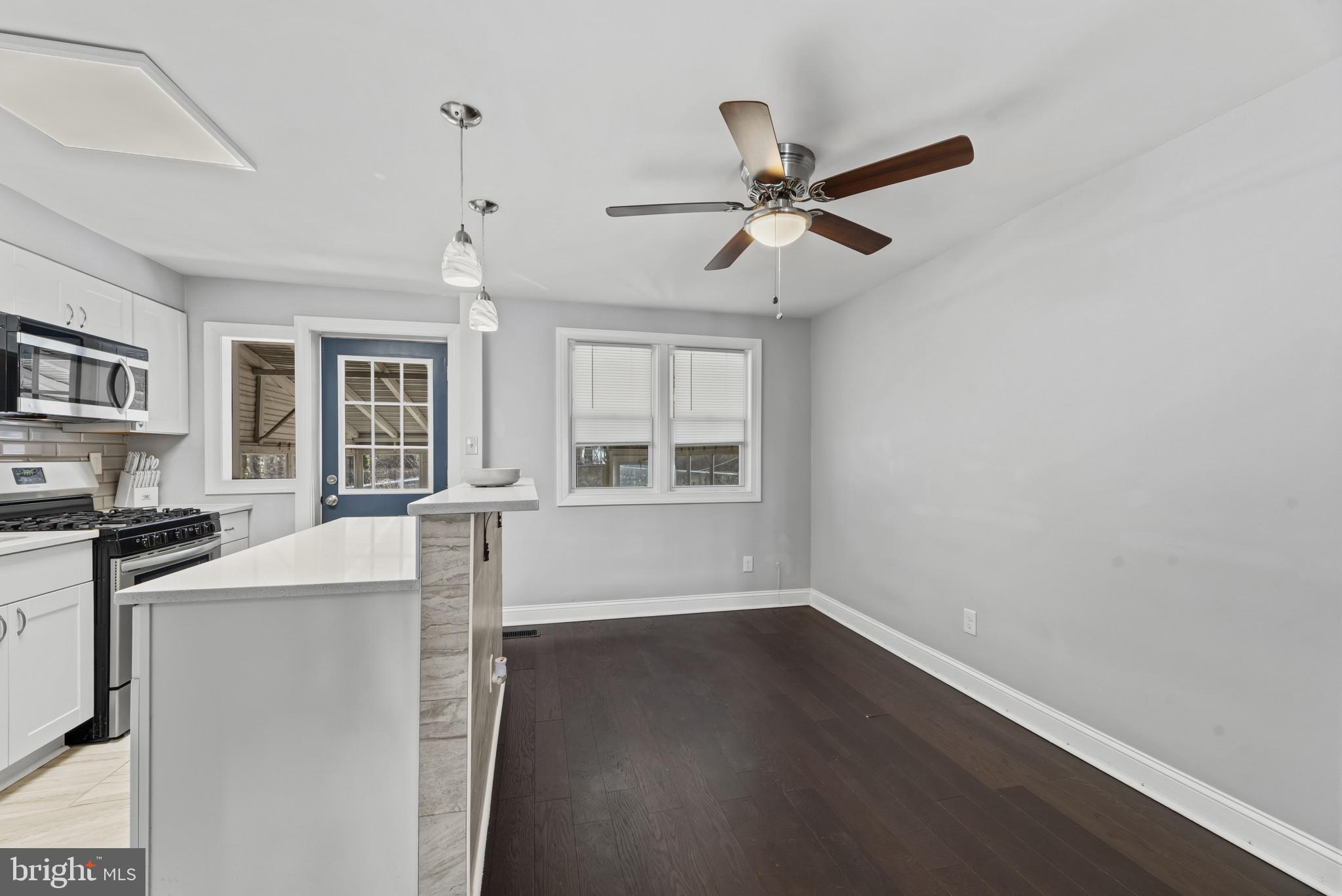 353 Leeanne Road Essex, MD 21221 - Photo 6 of 29 a view of a kitchen with furniture and windows