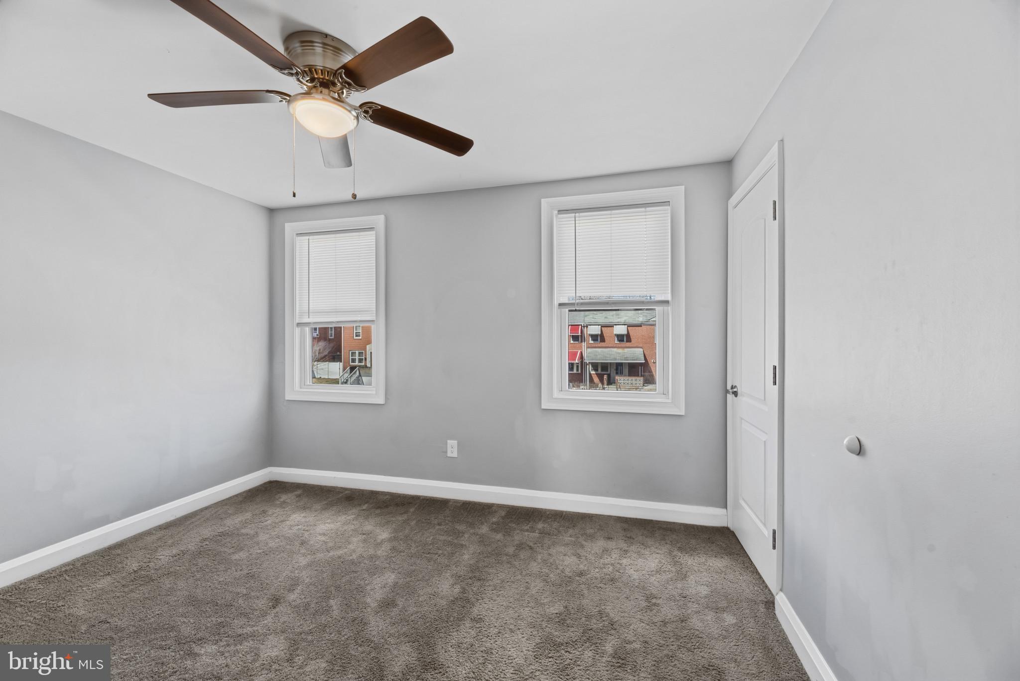 353 Leeanne Road Essex, MD 21221 - Photo 10 of 29 an empty room with windows and fan