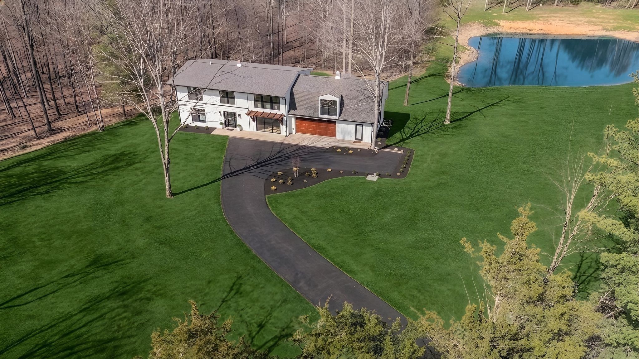 1510 East Piney Road Dickson, TN 37055 - Photo 3 of 66 a aerial view of a house with a yard table and chairs