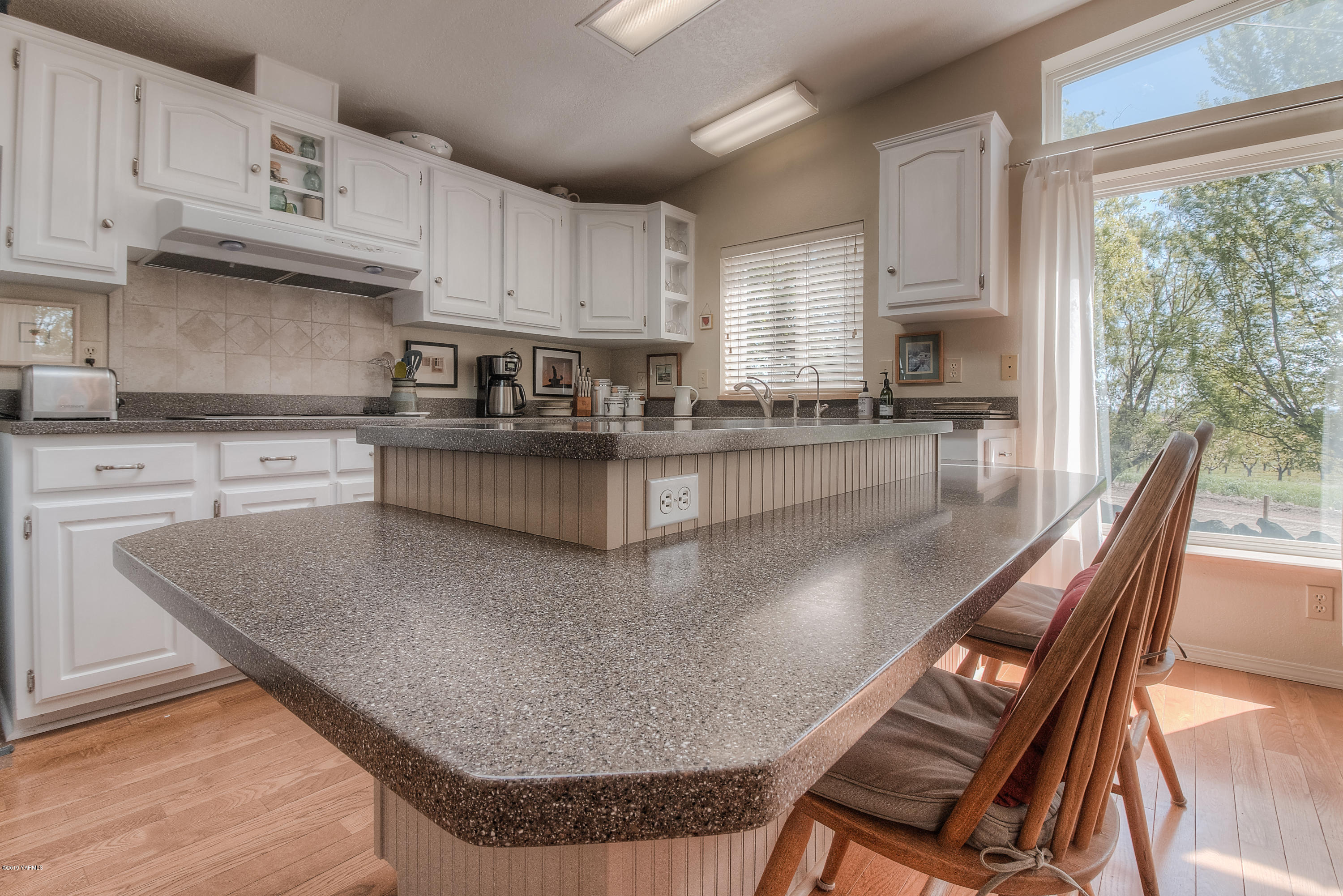 350 Schraeder Road Tieton, WA 98947 - Photo 11 of 39 a kitchen with stainless steel appliances granite countertop a sink a stove top oven a counter space and cabinets