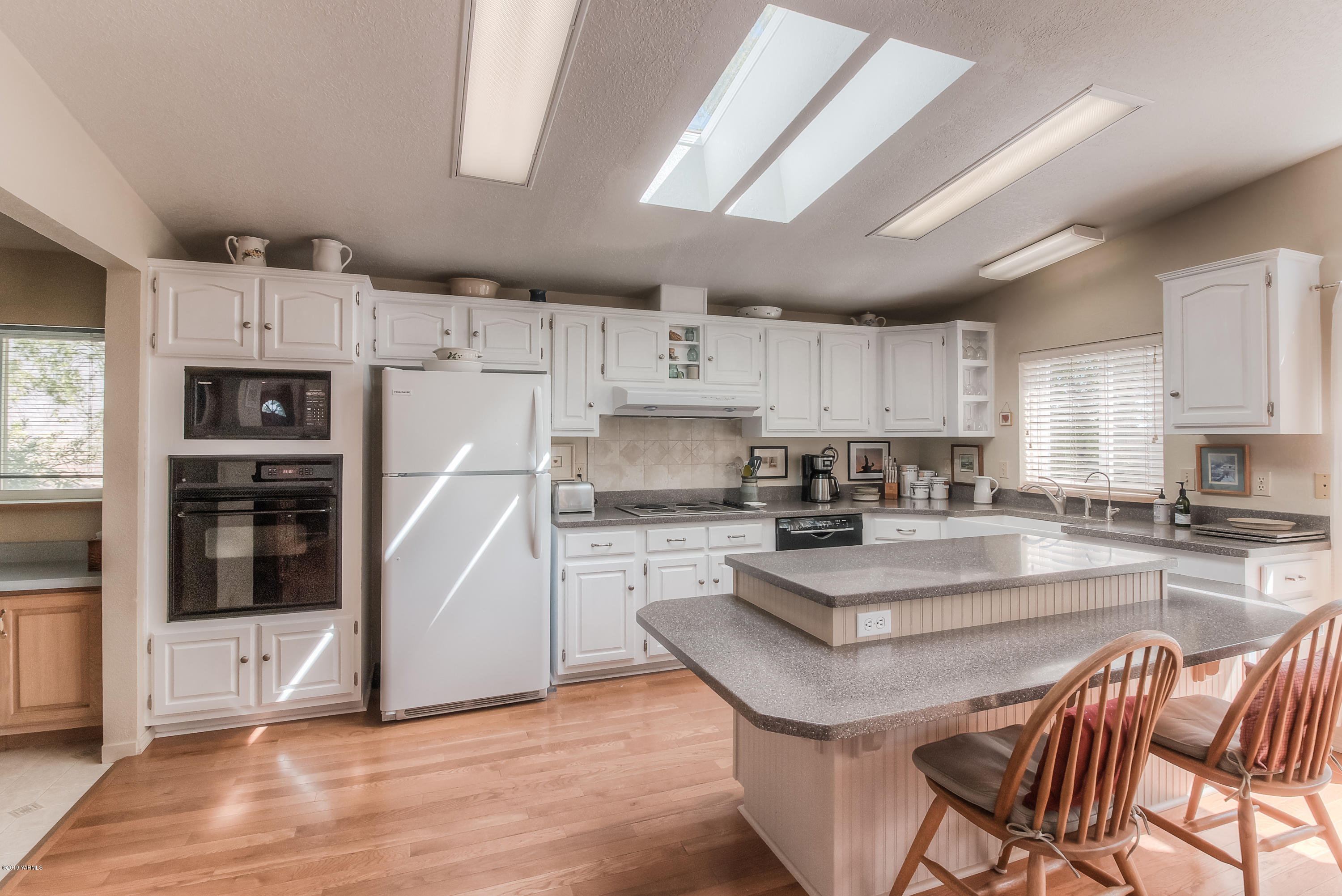 350 Schraeder Road Tieton, WA 98947 - Photo 6 of 39 a kitchen with stainless steel appliances granite countertop a stove refrigerator sink and cabinets