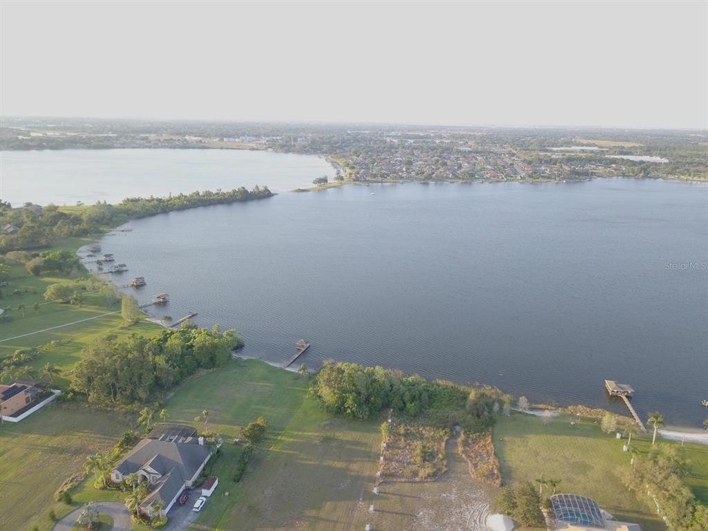 7820 Thompson Nursery Road Winter Haven, FL 33884 - Photo 4 of 7 a view of a lake with a yard