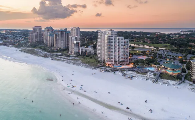 an aerial view of a house with a lake view