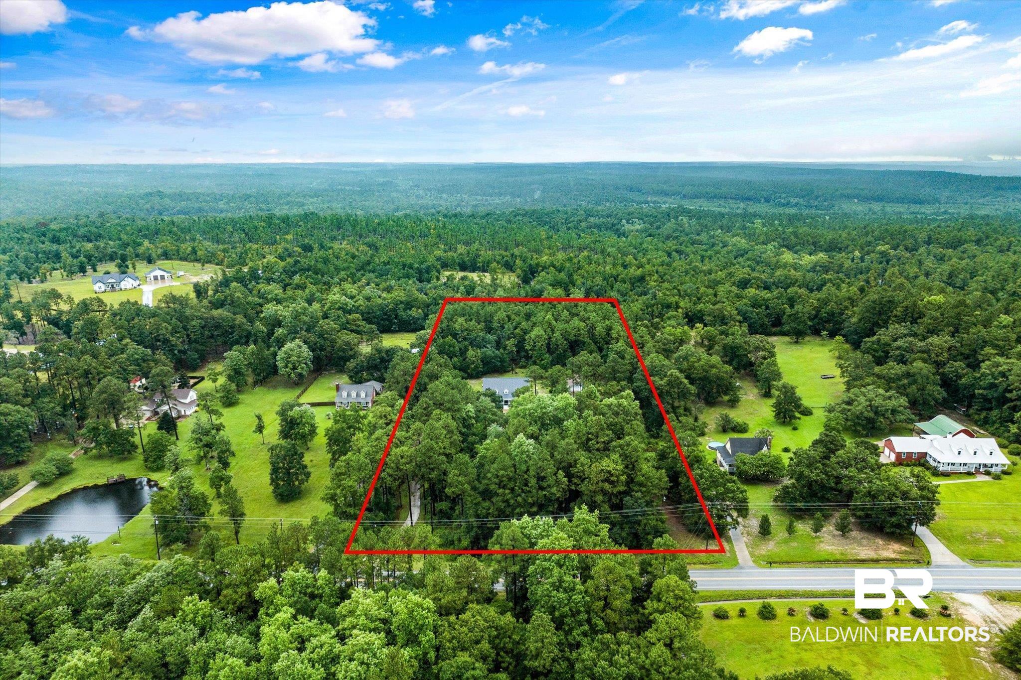 2300 Radcliff Road Saraland, AL 36571 - Photo 46 of 56 Aerial view of property and surrounding area featuring a heavily wooded area and property parcel outlined