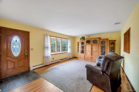 a living room with furniture and a window