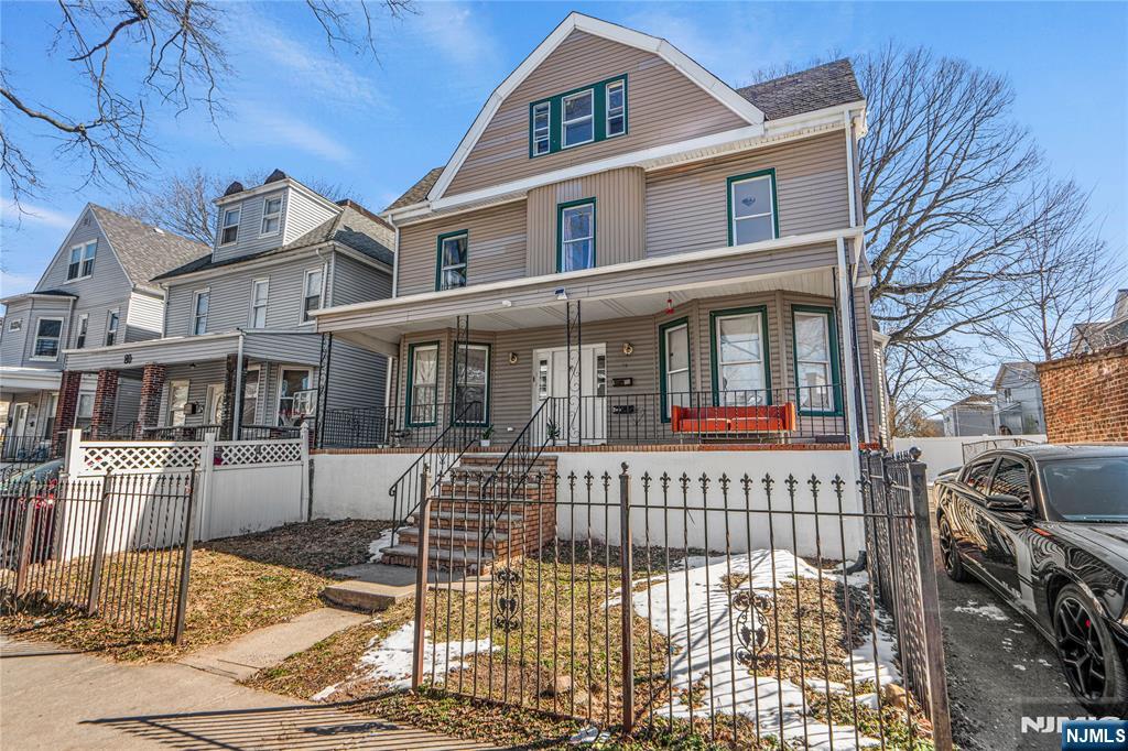 a view of a brick house with many windows