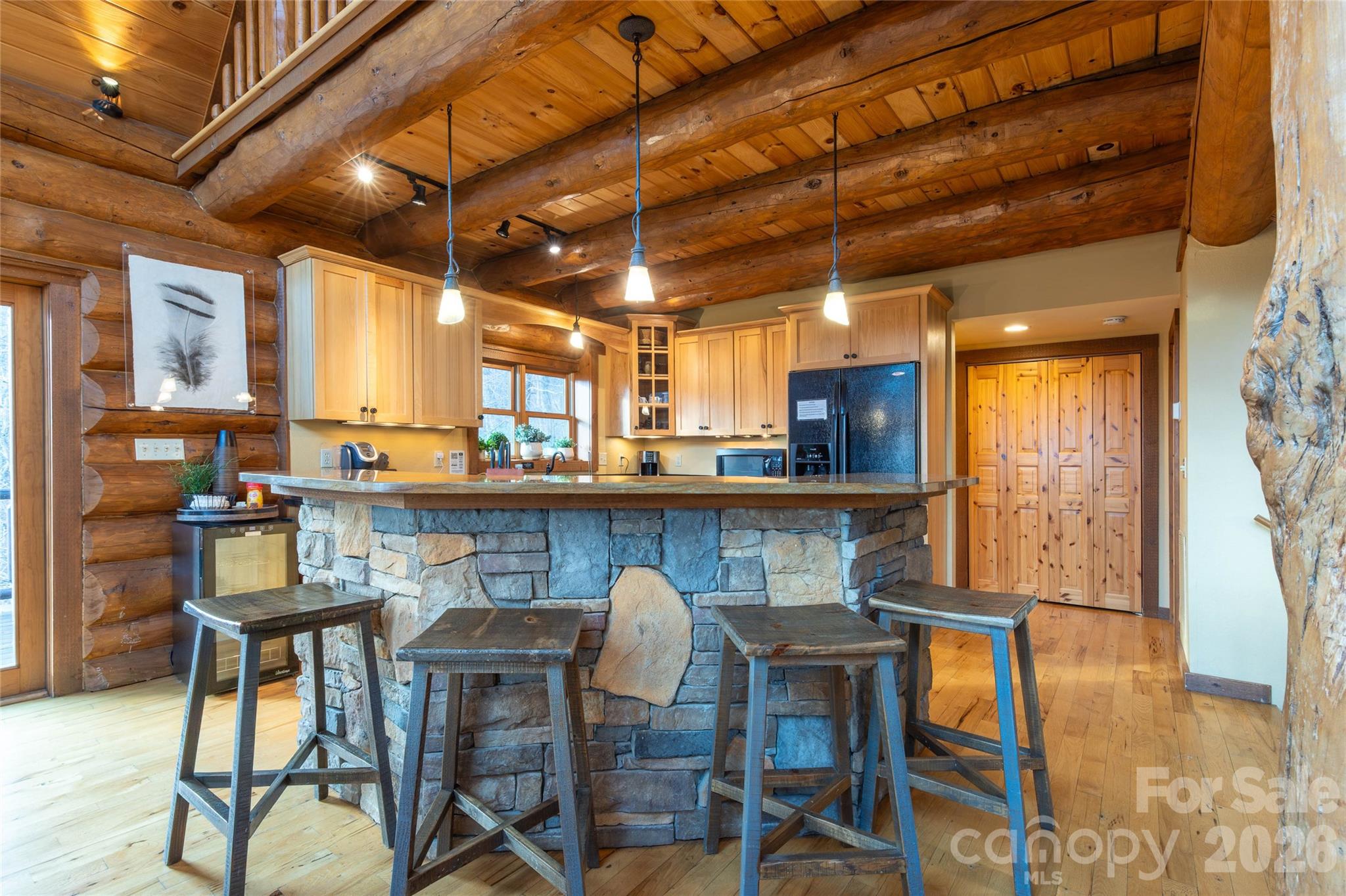 1391 Still Branch Road Sylva, NC 28779 - Photo 15 of 40 a view of a dining room with furniture and wooden floor