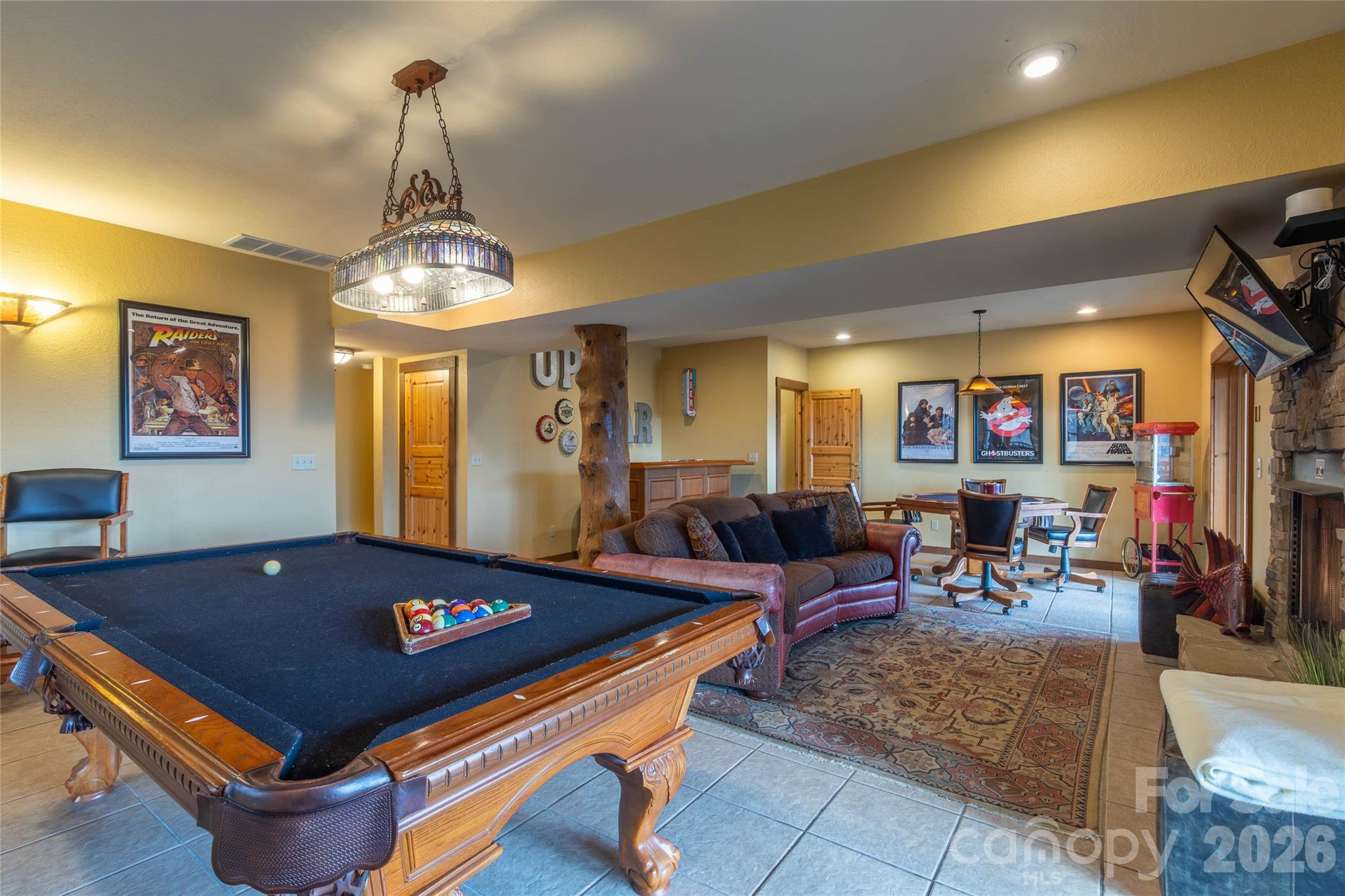 1391 Still Branch Road Sylva, NC 28779 - Photo 27 of 40 a living room with furniture and chandelier