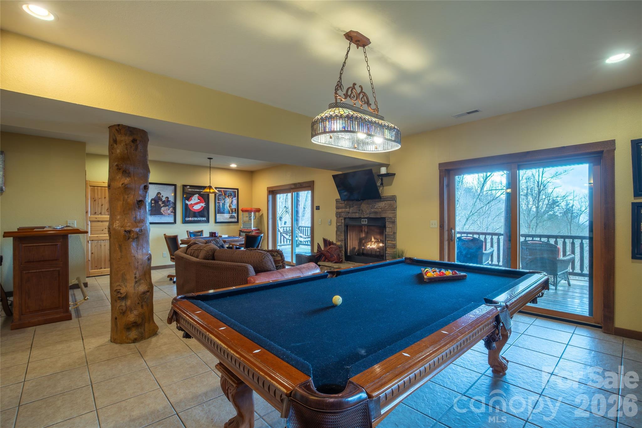 1391 Still Branch Road Sylva, NC 28779 - Photo 29 of 40 a room with chandelier furniture and a chandelier