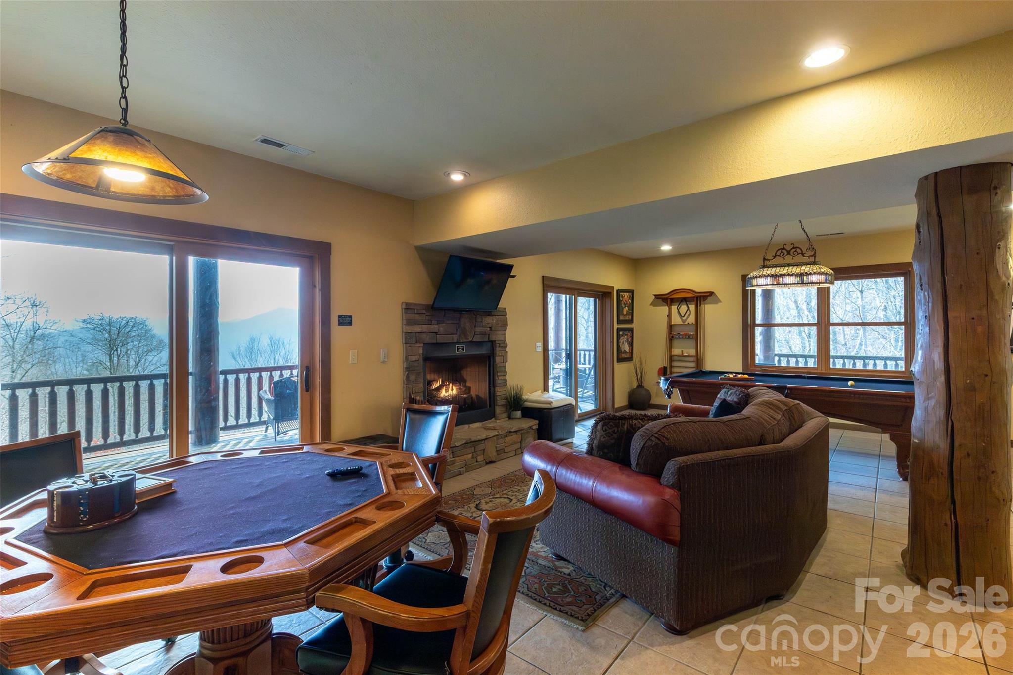 1391 Still Branch Road Sylva, NC 28779 - Photo 30 of 40 a living room with furniture and a chandelier