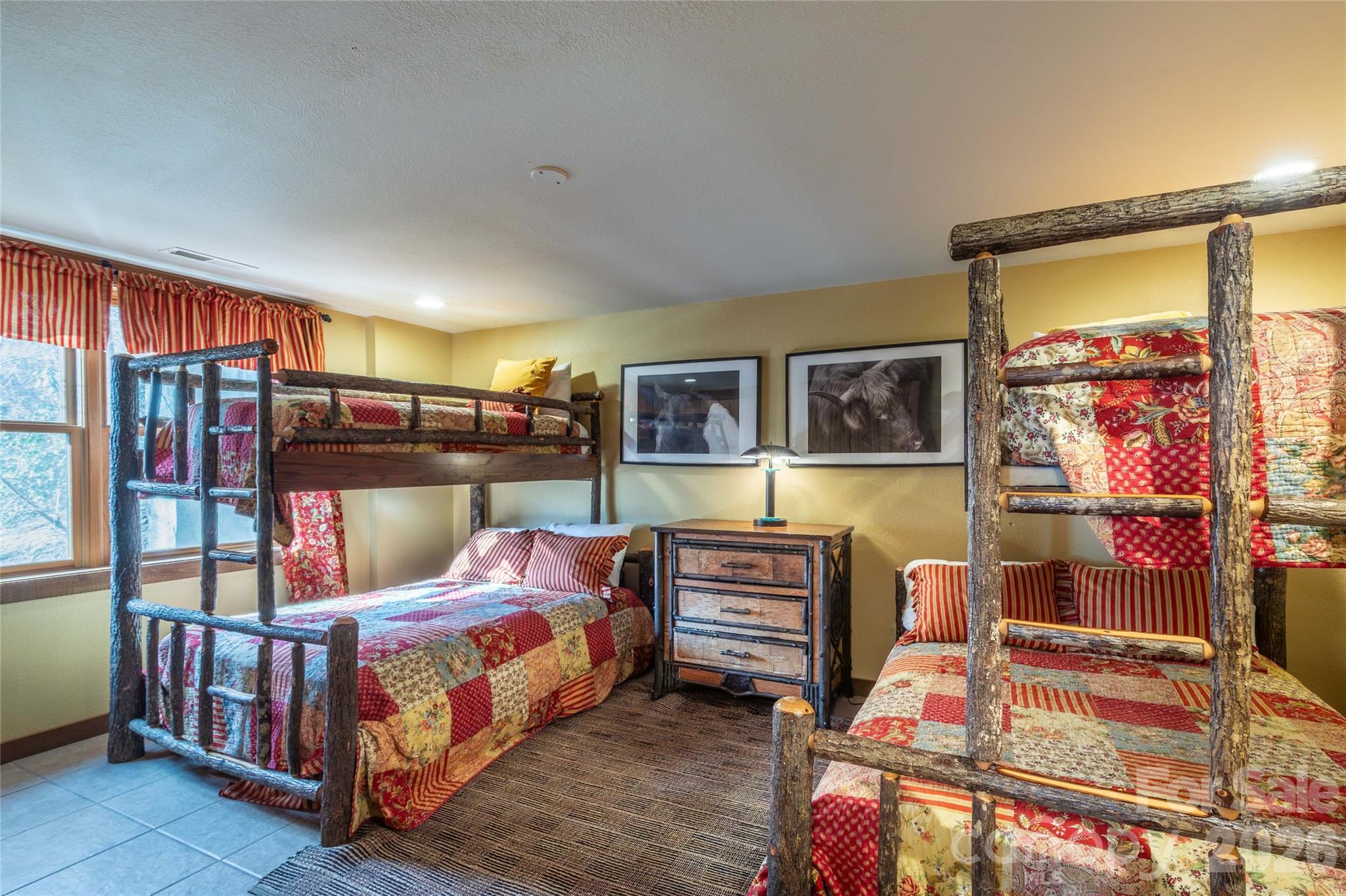 1391 Still Branch Road Sylva, NC 28779 - Photo 31 of 40 a bedroom with furniture and a flat screen tv