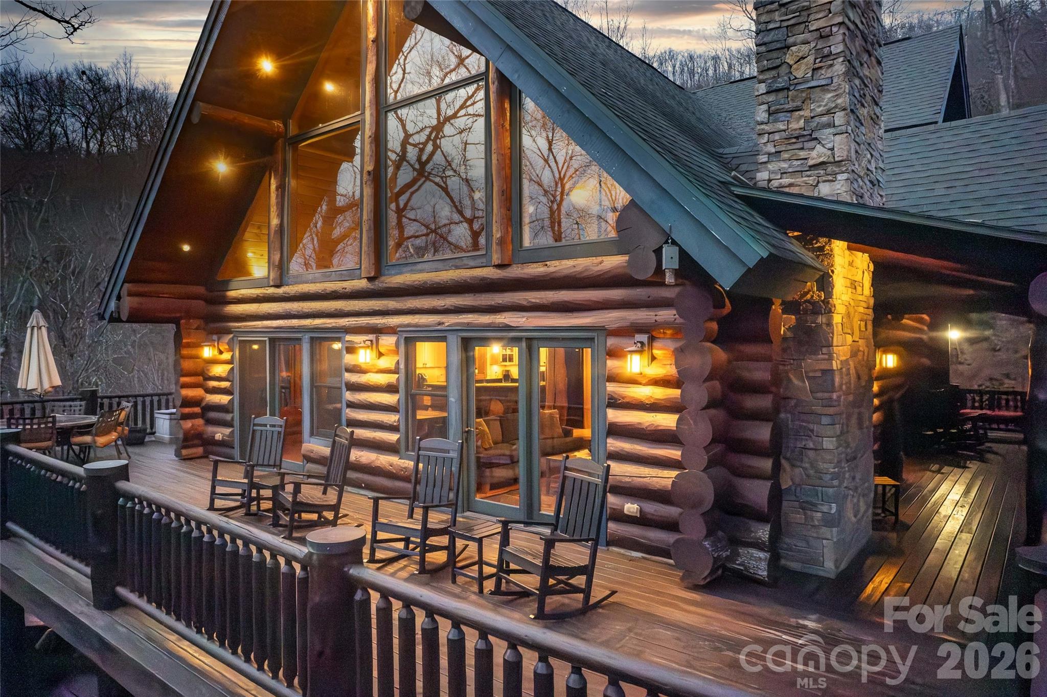 1391 Still Branch Road Sylva, NC 28779 - Photo 4 of 40 a view of a balcony with a dining space