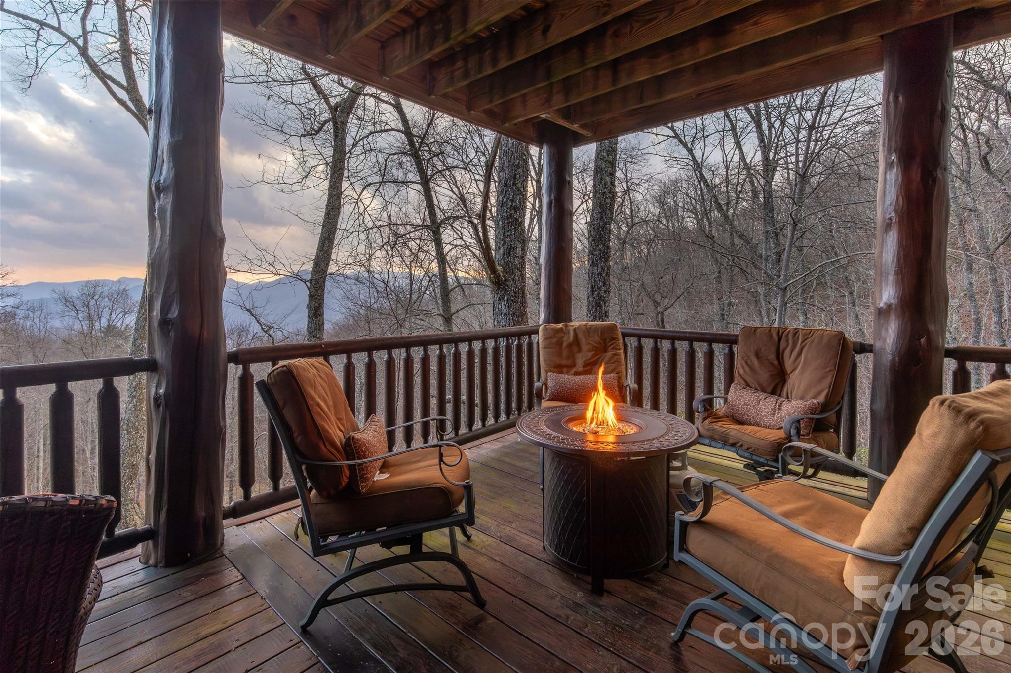 1391 Still Branch Road Sylva, NC 28779 - Photo 6 of 40 a view of a chairs and table in the balcony