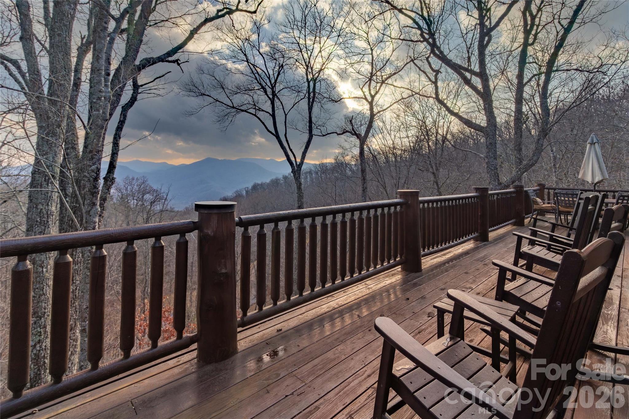 1391 Still Branch Road Sylva, NC 28779 - Photo 7 of 40 a view of a roof deck with wooden floor and fence