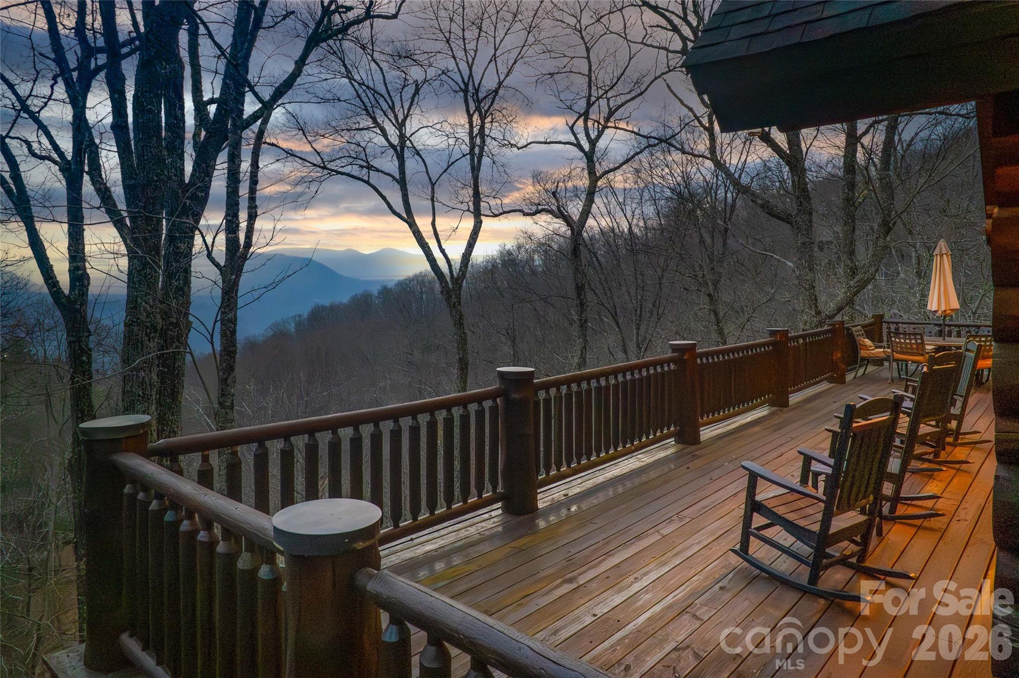 1391 Still Branch Road Sylva, NC 28779 - Photo 8 of 40 a view of balcony with wooden floor and outdoor seating