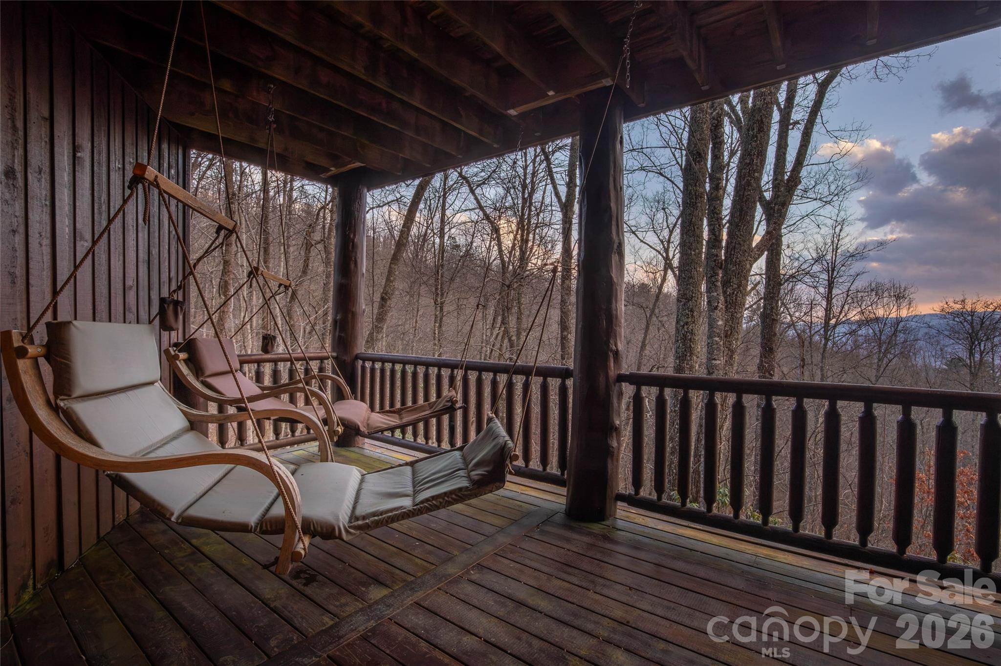 1391 Still Branch Road Sylva, NC 28779 - Photo 9 of 40 a view of a chairs and table in the balcony
